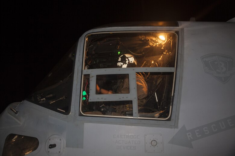 A U.S. Marine with Marine Medium Tiltrotor Squadron (VMM) 268, nicknamed the “Red Dragons,” conducts last minute safety checks before exiting a MV-22B Osprey after completing a trans-Pacific flight from Australia, Marine Corps Base Hawaii (MCBH), Sept. 19, 2017. The “Red Dragons” supported the Australian Defence Force as the aviation combat element for the Marine Air-Ground Task Force (MAGTF) with Marine Rotational Force Darwin (MRF-D), Australia. These are the first Trans-Pacific flights the MV-22 Ospreys have conducted from Hawaii to Australia. This movement demonstrates that the unfueled range of our MV-22s combined with our refueling capabilities allow us to reach across the entire Pacific Ocean. The U.S. Marine Corps can get it's aircraft and personnel to a crisis on the other side of the world in a matter of days. (U.S. Marine Corps photo by Cpl. Jesus Sepulveda Torres)