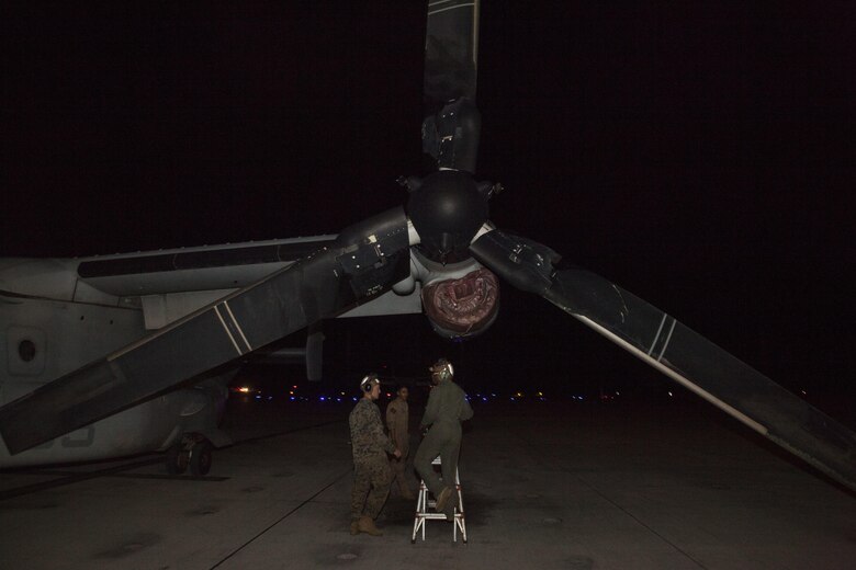 U.S. Marines with Marine Medium Tiltrotor Squadron (VMM) 268, nicknamed the “Red Dragons,” prepare to cover up exhaust ports on an MV-22B Osprey after completing a trans-Pacific flight from Australia, Marine Corps Base Hawaii (MCBH), Sept. 19, 2017. The “Red Dragons” supported the Australian Defence Force as the aviation combat element for the Marine Air-Ground Task Force (MAGTF) with Marine Rotational Force Darwin (MRF-D), Australia. These are the first Trans-Pacific flights the MV-22 Ospreys have conducted from Hawaii to Australia. This movement demonstrates that the unfueled range of our MV-22s combined with our refueling capabilities allow us to reach across the entire Pacific Ocean. We can get our aircraft and personnel to a crisis on the other side of the world in a matter of days. (U.S. Marine Corps photo by Cpl. Jesus Sepulveda Torres)