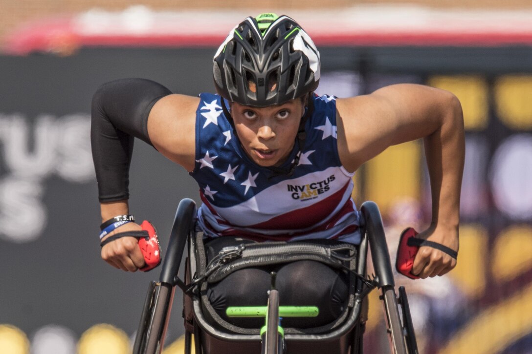 A Marine Corps veteran races in a wheelchair.