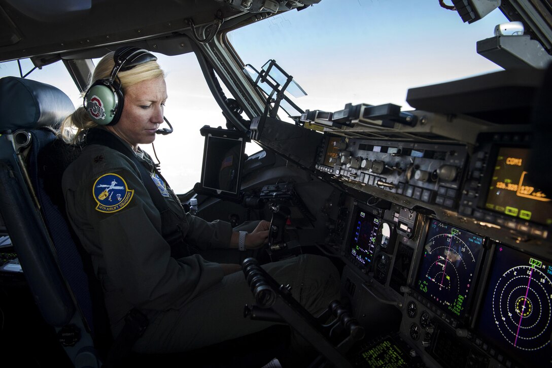 Maj. Kari Fleming fly’s a C-17 Globemaster III aircraft over the U.S. Virgin Islands.