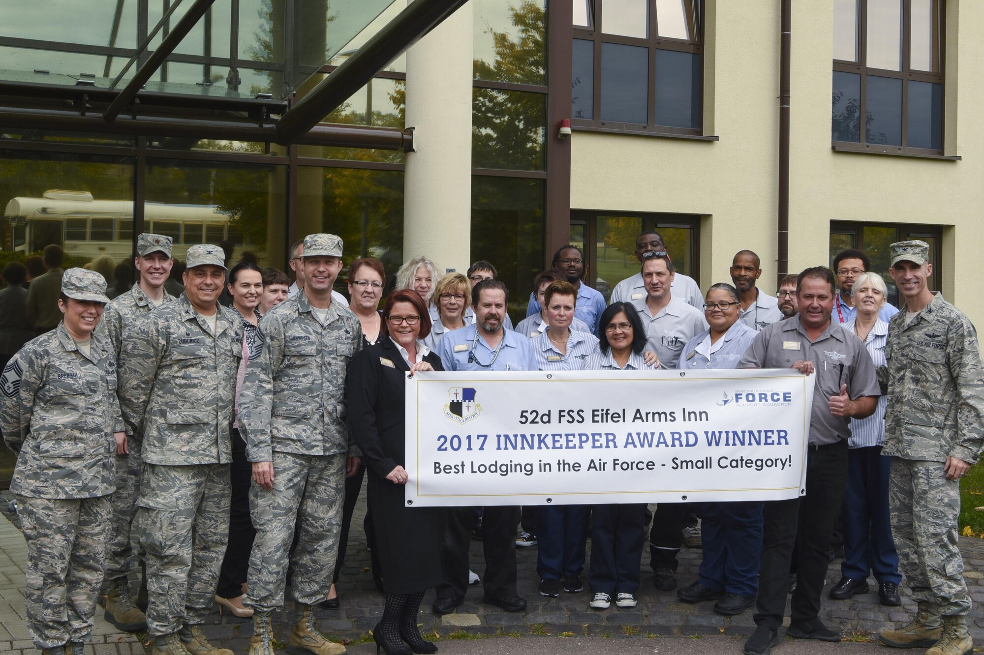 Col. Jason Bailey, 52nd Fighter Wing command, and Chief Master Sgt. Edwin Ludwigsen, 52nd FW command chief, pose with members of the Eifel Arms Inn at Spangdahlem Air Base, Germany, September 26, 2017. The Eifel Arms Inn celebrated its fifth win as the Best Lodging in the Air Force - Small Category. (U.S. Air Force photo by Senior Airman Dawn M. Weber)
