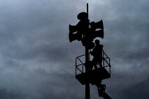 A worker performs maintenance work on a public announcement system on Ramstein Air Base, Germany, Aug. 8, 2017. Public announcement loudspeakers are used on installations throughout the Air Force as a way to notify the public of various emergencies and exercises. (U.S. Air Force photo by Airman 1st Class Joshua Magbanua)