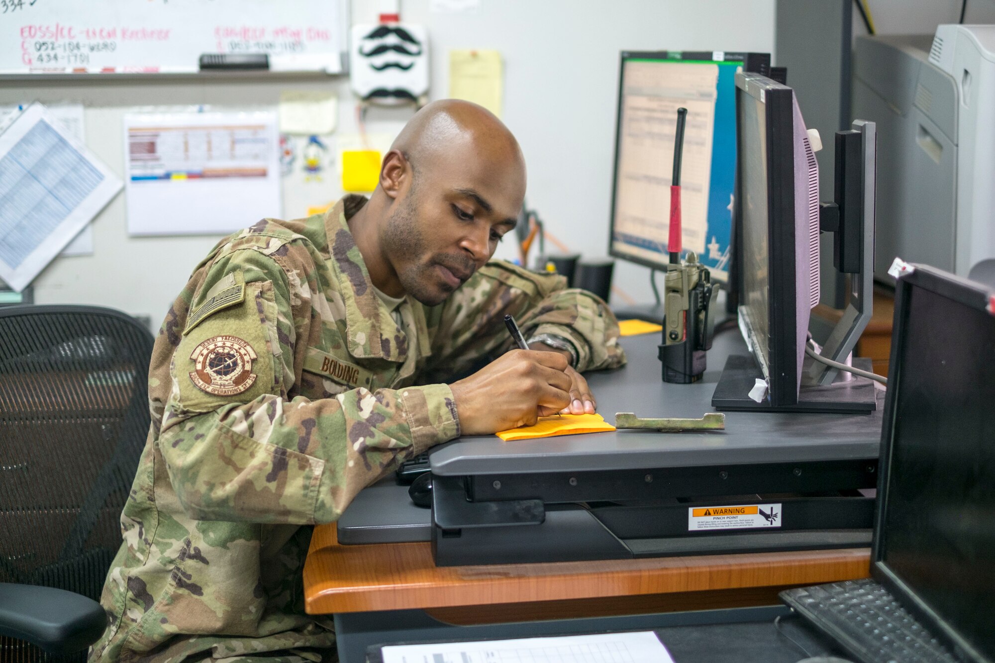 Staff Sgt. Dionta Bolding, 380th Expeditionary Operations Support Squadron deputy airfield manager, documents foreign-object debris after it’s been removed from a flightline, September 21, 2017, at Al Dhafra Air Base, United Arab Emirates.