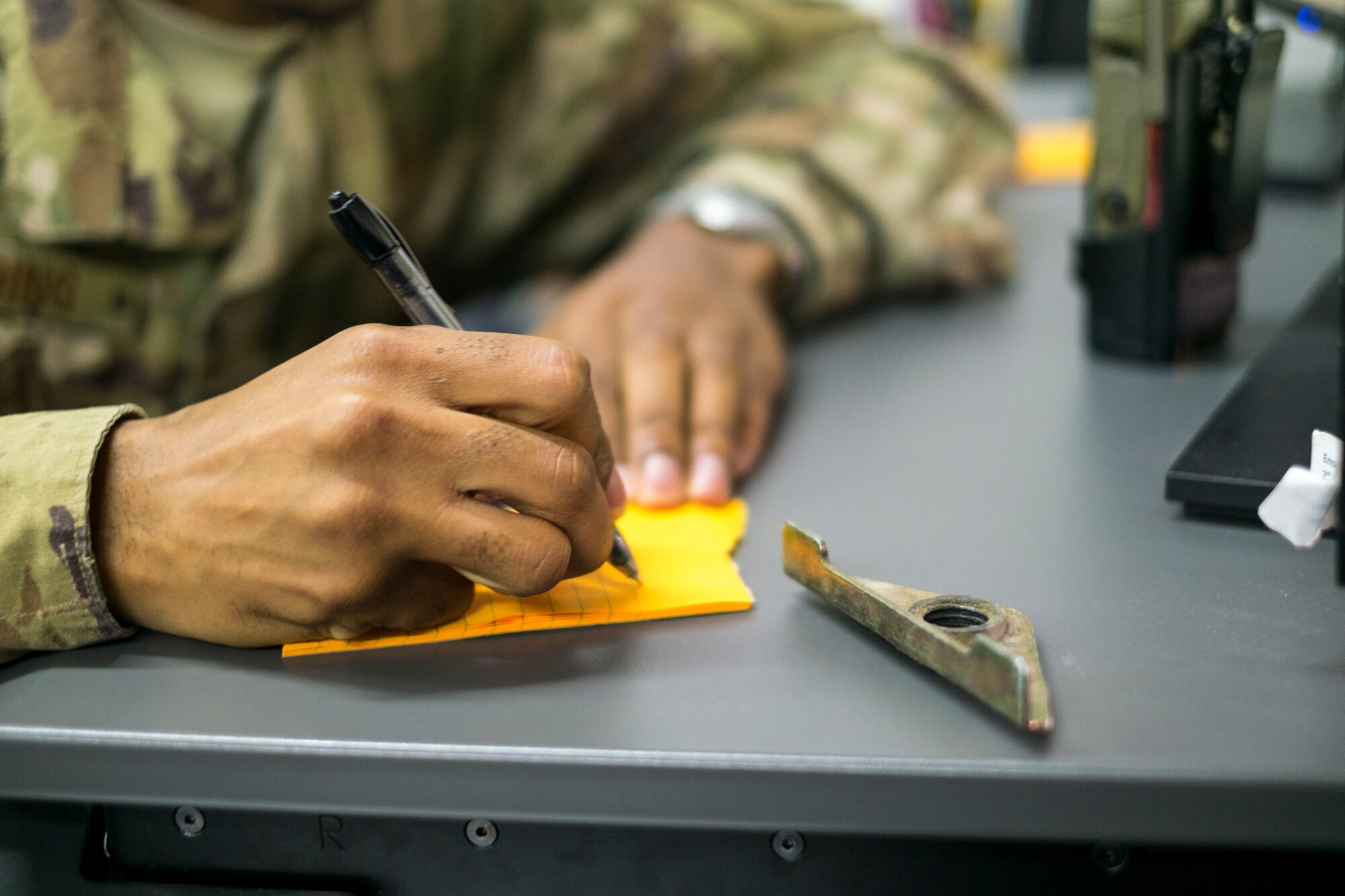 Staff Sgt. Dionta Bolding, 380th Expeditionary Operations Support Squadron deputy airfield manager, documents foreign-object debris after it’s been removed from a flightline, September 21, 2017, at Al Dhafra Air Base, United Arab Emirates.