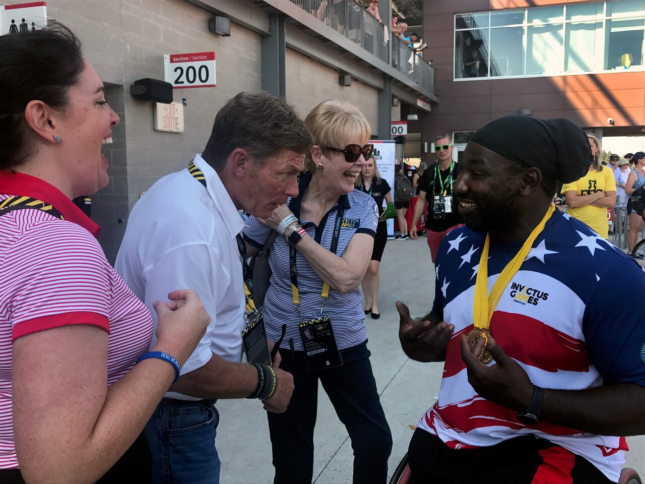 Ken Fisher, CEO and founder of Fisher House, jokes with Tony Pone, a medically retired Army specialist, after he earned gold medals in his disability category in the men’s discus and shot put during the 2017 Invictus Games in Toronto, Sept. 24, 2017. DoD photo by Shannon Collins