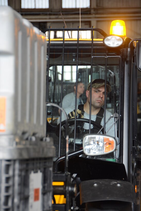 Massachusetts Task Force 1 member loading a pallet.