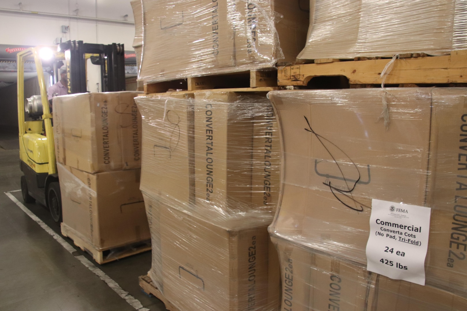 Cots are unloaded at DLA Distribution Warner Robins, Ga., for storage until dispatched to a FEMA-designated location.