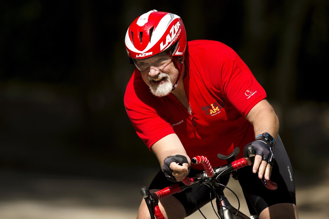 Team Denmark’s Allan Lohals races a bicycle during Invictus Games 2017.