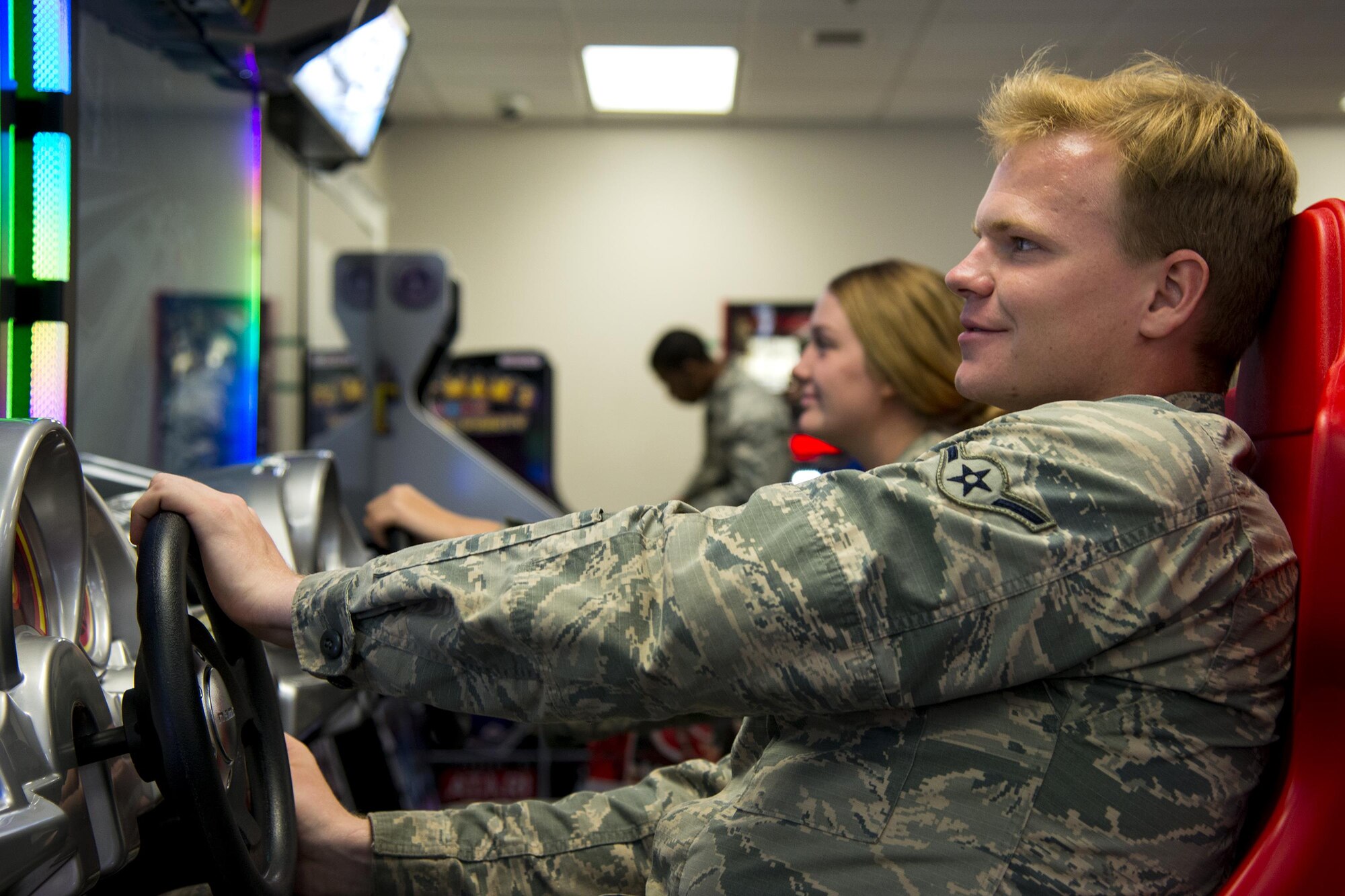 Airman Tucker Plunkert, 723d Aircraft Maintenance Squadron munitions systems journeyman, plays an arcade game, Sept. 15, 2017, at Moody Air Force Base, Ga. The 23d Civil Engineer Squadron dorm management office is revamping the day rooms to help foster better wingmanship and morale among Airmen living in the dorms. (U.S. Air Force photo by Airman 1st Class Erick Requadt)