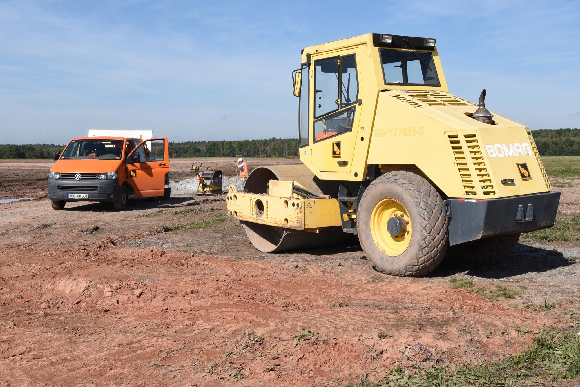 Contracted construction workers use heavy machinery for the infield drainage project on the flightline on Ramstein Air Base, Germany Sept. 21, 2017. The infield drainage project is scheduled to be complete in 2018. (U.S. Air Force photo by Airman 1st Class Milton Jr. Hamilton)