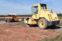 Contracted construction workers use heavy machinery for the infield drainage project on the flightline on Ramstein Air Base, Germany Sept. 21, 2017. The infield drainage project is scheduled to be complete in 2018. (U.S. Air Force photo by Airman 1st Class Milton Jr. Hamilton)