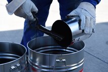 A German contractor mixes tar that will be placed in the drains of the flightline on Ramstein Air Base Sept. 21, 2017. Once on site, the tar was blended together into bigger containers. (U.S. Air Force photo by Airman 1st Class Milton Jr. Hamilton)
