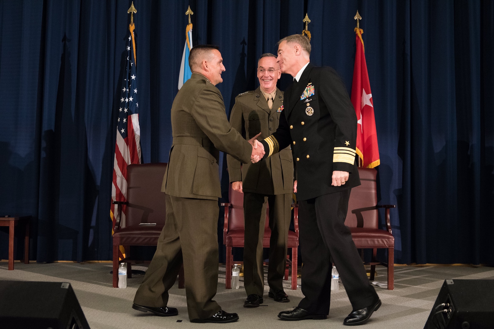 Maj Gen Padilla shakes hands with VADM Roegge with Gen Dunford looking on.