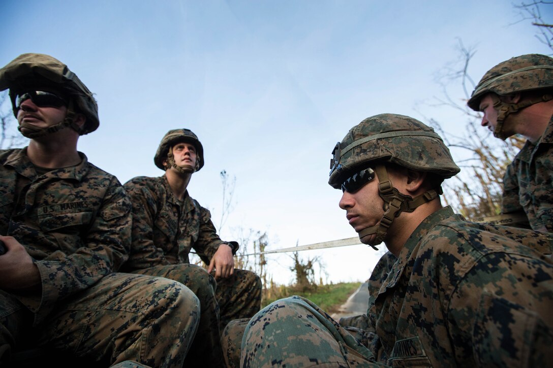 U.S. Marines with Battalion Landing Team 2nd Battalion, 6th Marine Regiment, 26th Marine Expeditionary Unit (MEU), return to their base of operations after conducting route clearing operations in support of relief efforts  for victims of Hurricane Maria in Ceiba, Puerto Rico, Sept. 25, 2017.The 26th MEU is supporting the Federal Emergency Management Agency, the lead federal agency, and local authorities in Puerto Rico and the U.S. Virgin Islands with the combined goal of protecting the lives and safety of those in affected areas. (U.S. Marine Corps photo by Lance Cpl. Tojyea G. Matally)