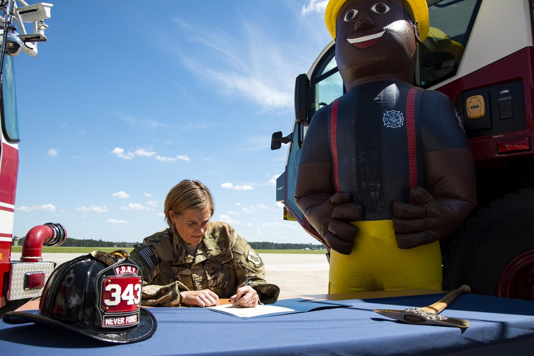 Col. Jennifer Short, 23d Wing commander, signs a Fire Prevention Week proclamation, Sept. 25, 2017, at Moody Air Force Base, Ga. Short proclaimed the week of Oct. 8-14 as Fire Prevention Week, which is designed to commemorate the sacrifices of our firefighters and teach fire safety to others. (U.S. Air Force photo by Airman 1st Class Erick Requadt)