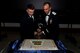 As a time-honored Air Force tradition, the most senior and youngest Airmen on station cut the Air Force Ball cake together.