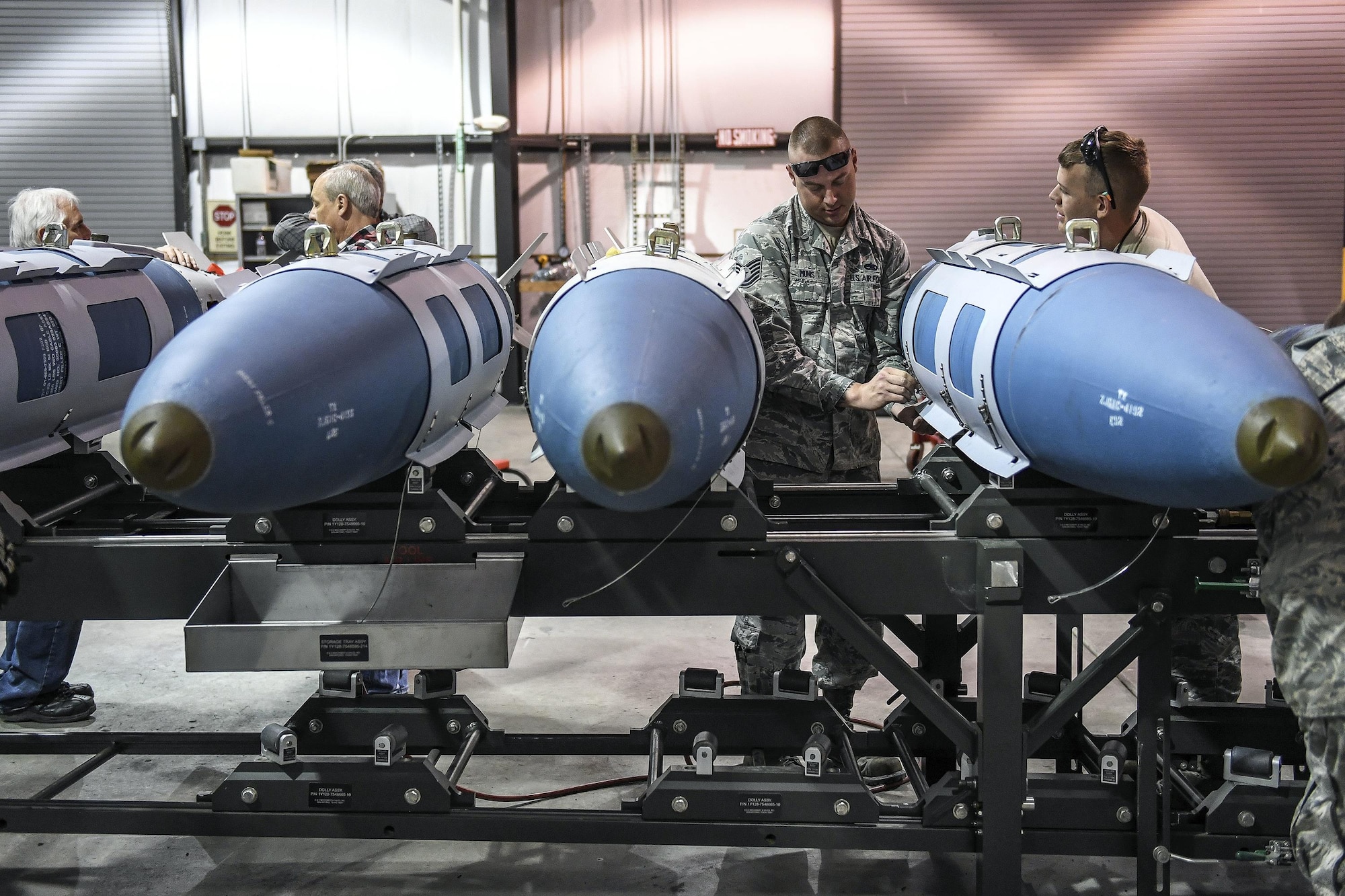 Active-duty Tech. Sgt. Joseph Munis, 301st Fighter Wing, Naval Air Station Fort Worth Joint Reserve Base, Texas, builds GBU-31 bombs April 26 at Hill Air Force Base, Utah.