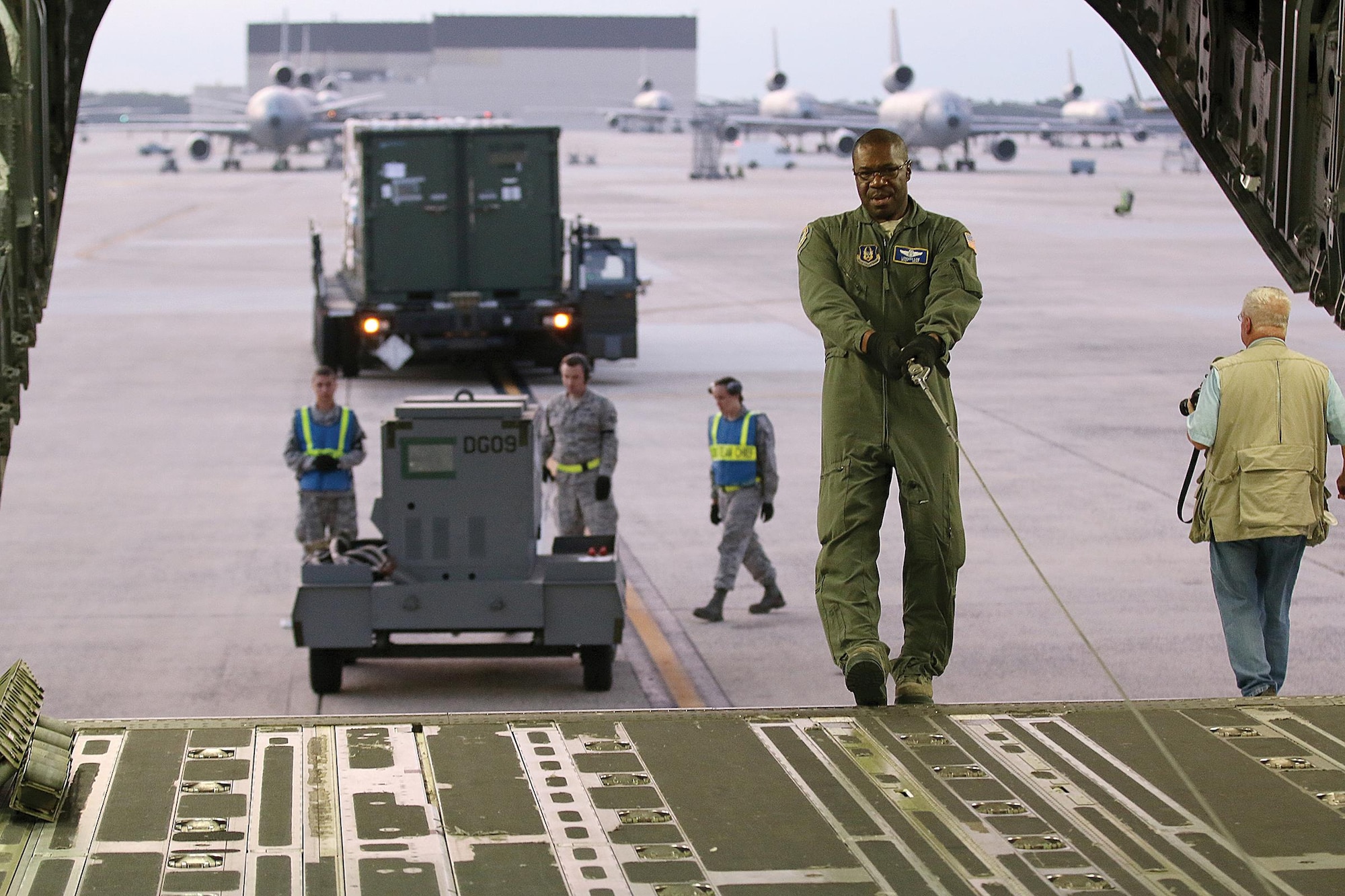 Master Sgt. Lorenzo Law, 89th Airlift Squadron loadmaster, prepares a 445th Airlift Wing C-17 Globemaster III at Joint Base McGuire-Dix-Lakehurst, New Jersey, for loading cargo and Airmen for transport to MacDill Air Force Base, Tampa, Florida, in support of Hurricane Irma relief efforts Sept. 12, 2017. (U.S. Air Force photo/Master Sgt. Patrick O'Reilly)