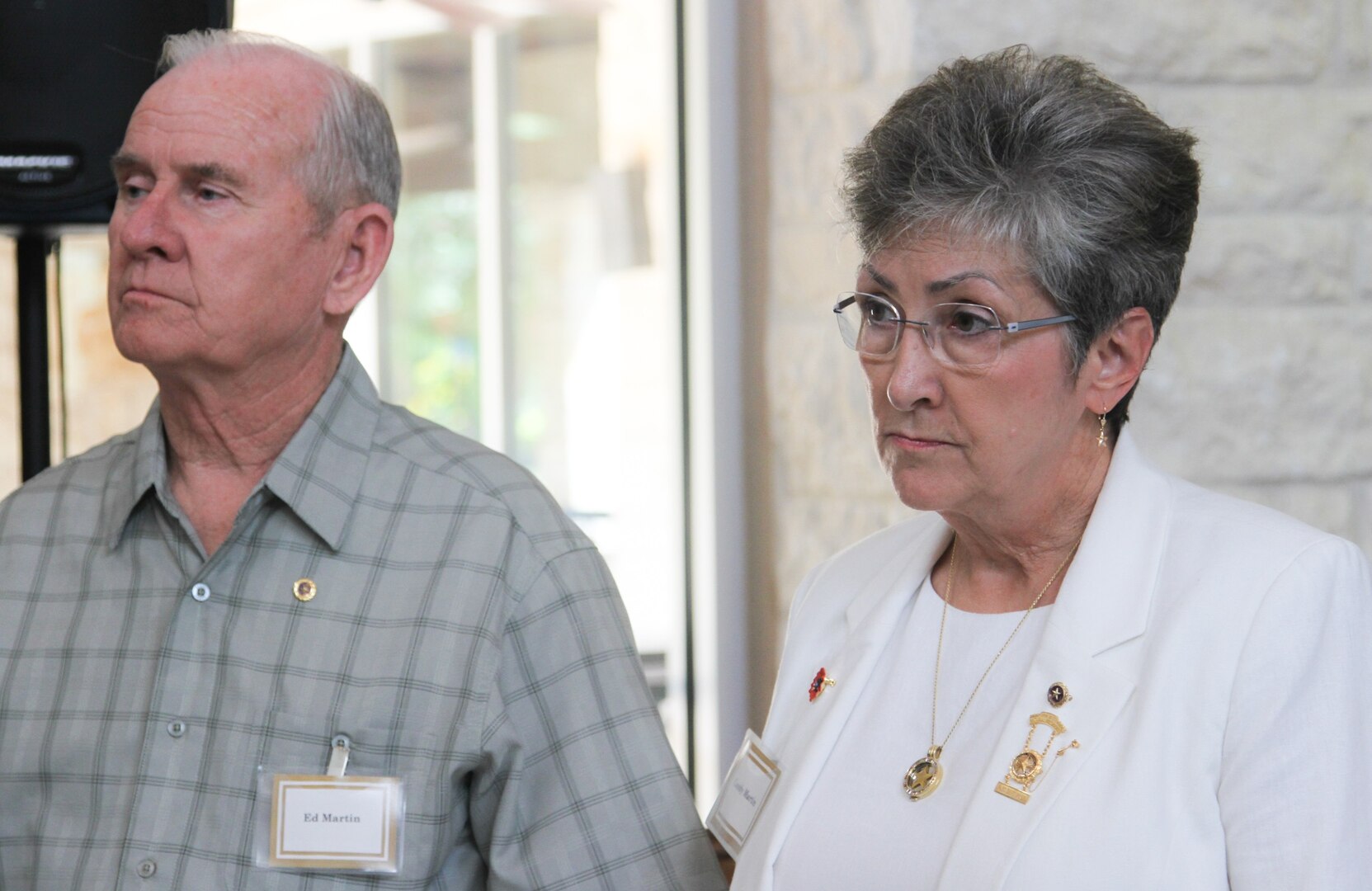 Candy Martin (right), the Army Reserve Ambassador for the 63d Regional Support Command, Mountain View, Calif., listens to a presentation with her husband Ed Martin during the Gold Star Mothers and Family luncheon Sept. 24 at the Warrior and Family Support Center at Joint Base San Antonio-Fort Sam Houston. Held every year on Gold Star Mothers' Day, the event honors family of U.S. service members who have fallen in the line of duty.