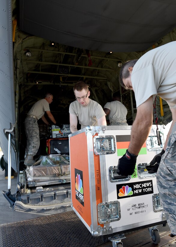 Airmen load NBC Nightly News equipment onto a Rhode Island Air National Guard C-130J cargo aircraft at Savannah Air National Guard Base, Georgia, Sept. 25, 2017. The NBC team embedded with the unit to cover the aftermath of Hurricane Maria. The trip included stops in St. Croix, Virgin Islands, and Puerto Rico. Media are authorized to embed with the National Guard to obtain news coverage of disaster relief so long as it does not affect missions. (U.S. Air National Guard photo/Master Sgt. Mike R. Smith)