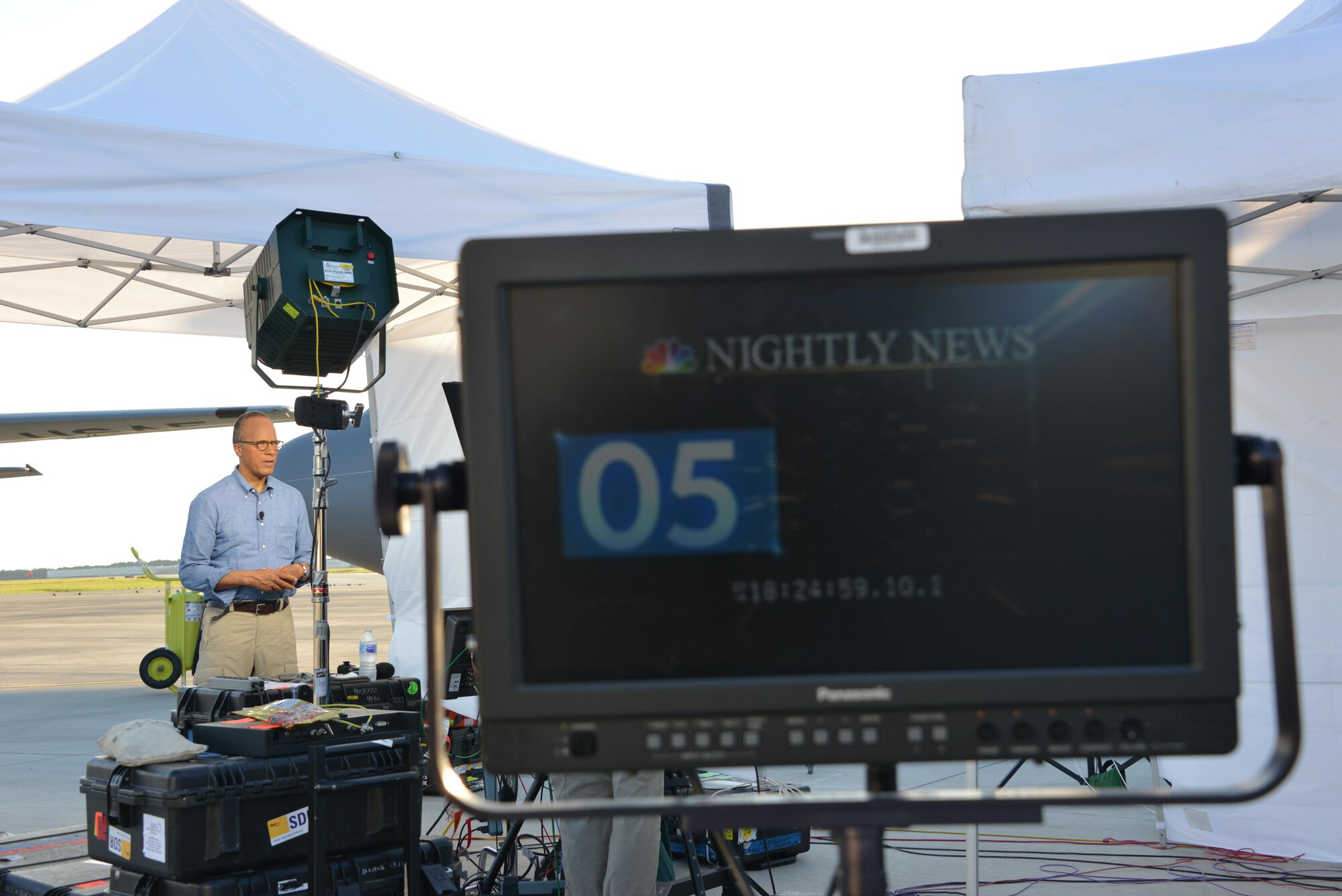 Lester Holt of NBC Nightly News broadcasts live from the flight line of the 165th Airlift Wing in Savannah, Georgia, Sept. 26, 2017. Holt and the NBC team covered the aftermath of Hurricane Maria traveling on a C-130H aircraft based out of the Rhode Island Air National Guard. The trip included stops in St. Croix, Virgin Islands, and Puerto Rico. (U.S. Air National Guard photo/Staff Sgt. Chelsea Smith)