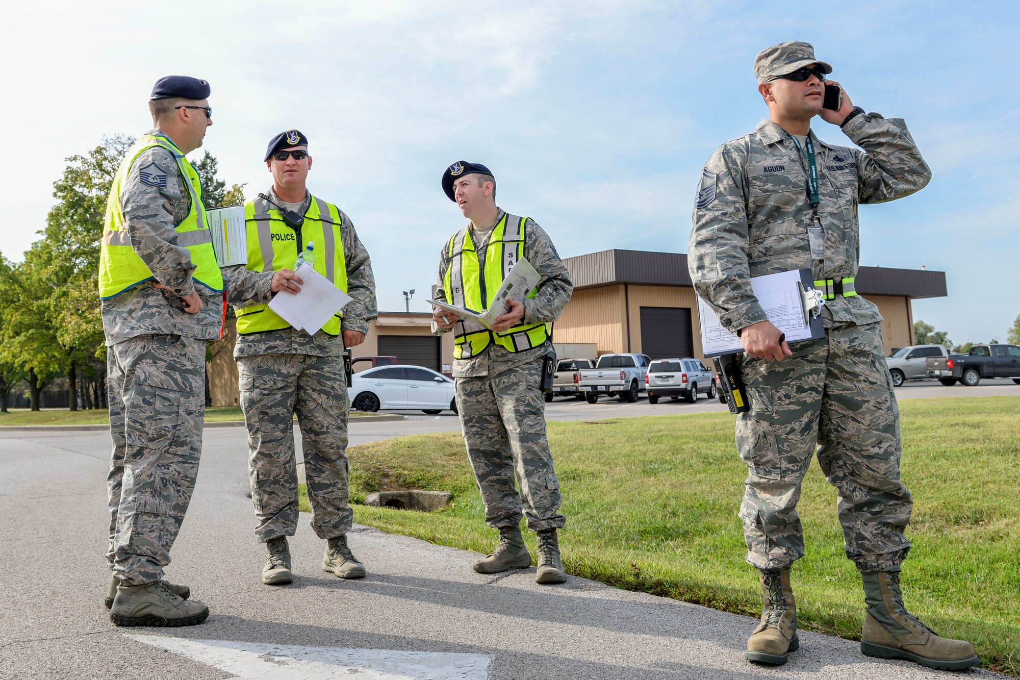 Members of the 375th Inspector General and Wing Inspection Team evaluate procedures during an active shooter exercise at Scott Air Force Base, Ill., Sept. 21, 2017.