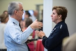 Air Force Gen. Lori Robinson speaks with Air Force Gen Paul Selva during a meeting at Andrews Air Force Base.