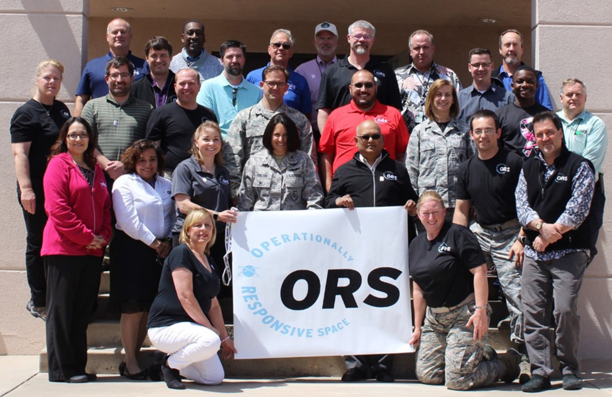 Members of Operationally Responsive Space pose outside their building. The office celebrates its 10th anniversary this year.