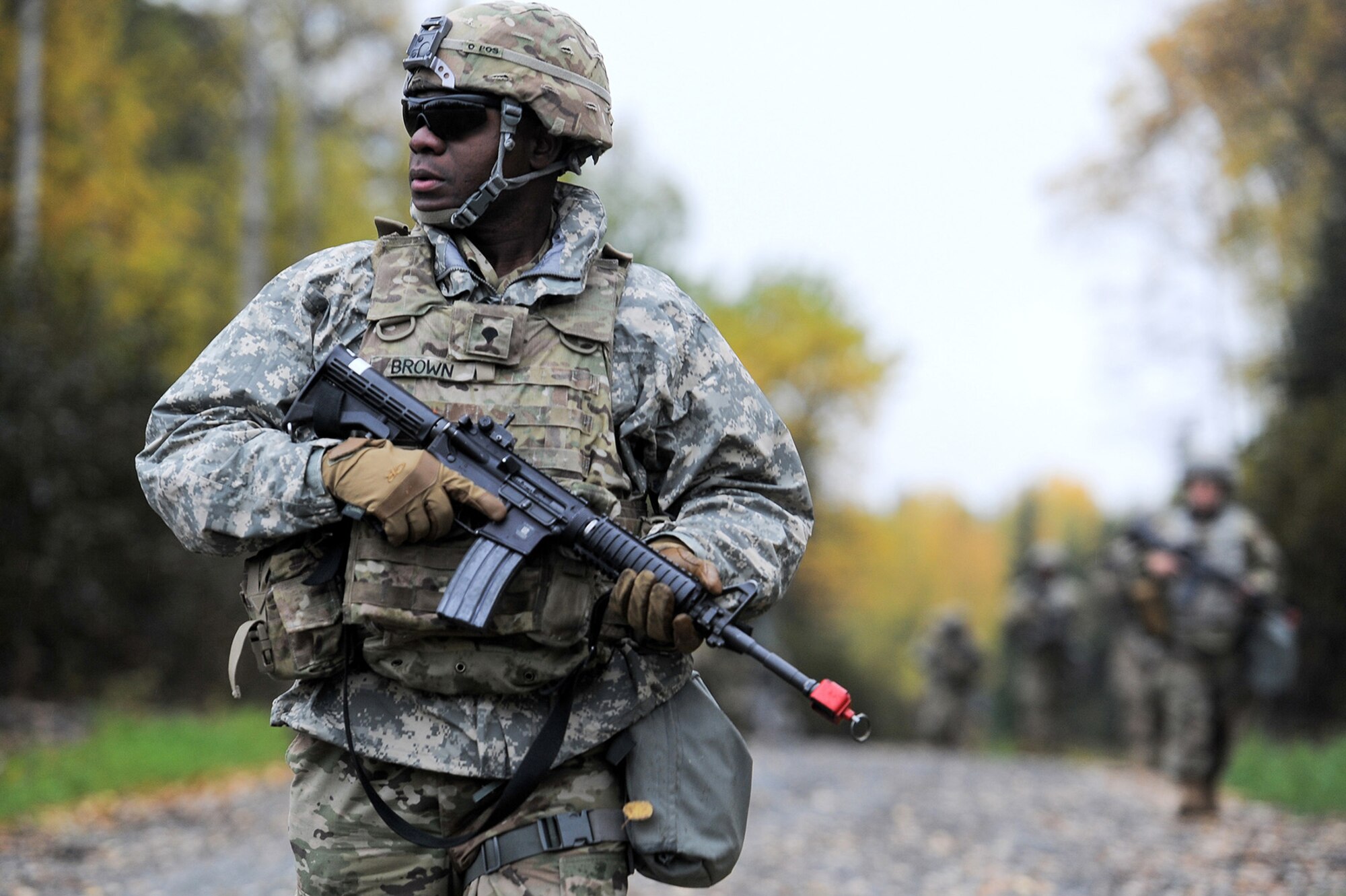 Spc. Stephen Brown, assigned to the 109th Transportation Company "Muleskinners", 17th Combat Sustainment Support Battalion, U.S. Army Alaska, executes tactical movement with fellow Soldiers during an exercise on Joint Base Elmendorf-Richardson, Alaska, Sept. 21, 2017.  The Soldiers performed react to contact, and securing an objective as well as traffic control point training as part of a larger exercise in multiple locations to build and maintain proficiency in essential soldiering skills.