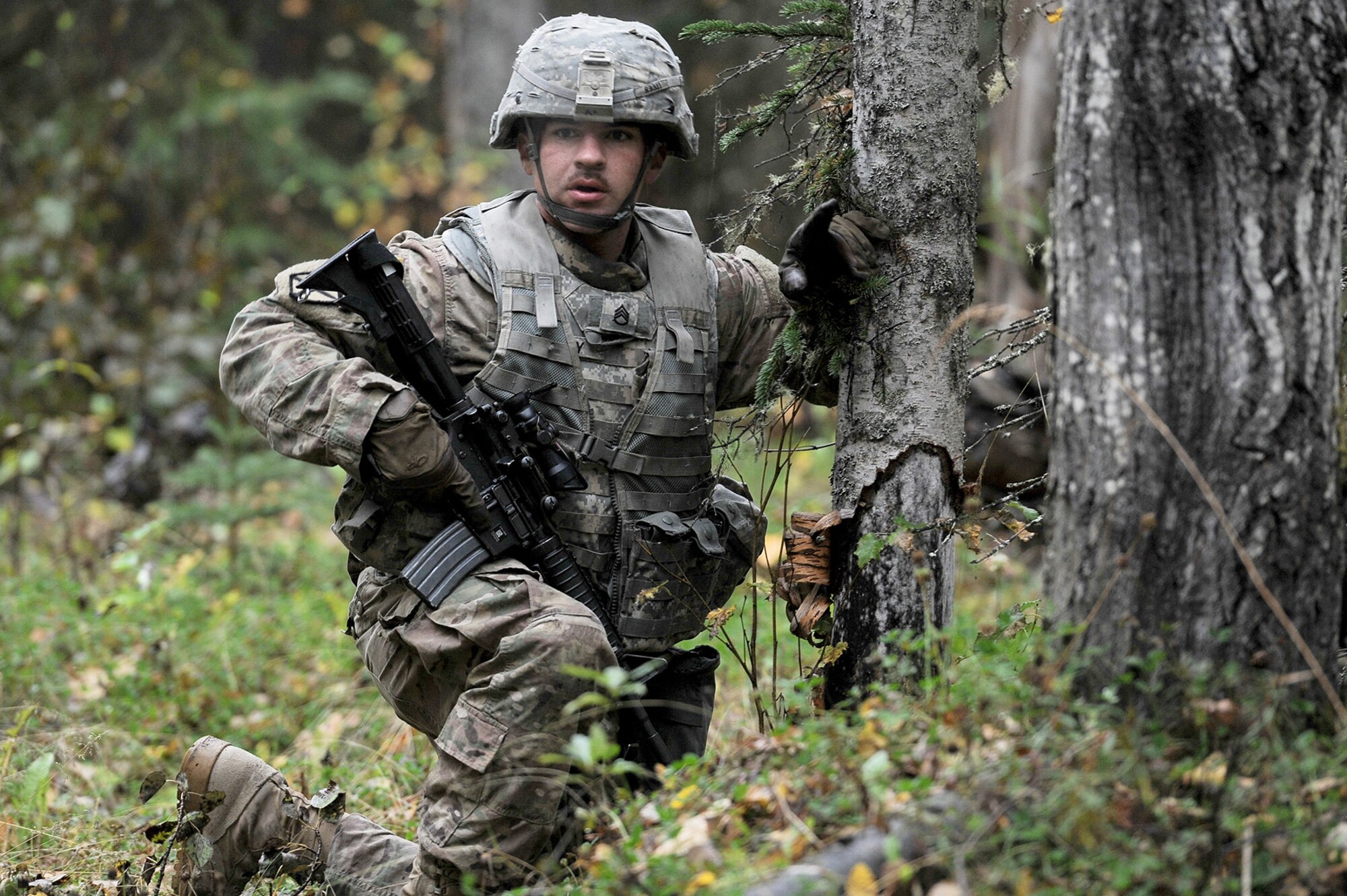 Army Staff Sgt. David Riley, assigned to the 109th Transportation Company "Muleskinners", 17th Combat Sustainment Support Battalion, U.S. Army Alaska, gives an order to one of his Soldiers while bounding on an objective during an exercise on Joint Base Elmendorf-Richardson, Alaska, Sept. 21, 2017.  The Soldiers performed this training as part of a larger exercise in multiple locations to build, and maintain proficiency in essential soldiering skills.