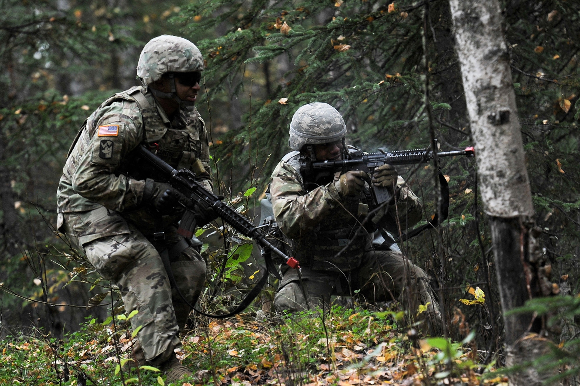 Soldiers assigned to the 109th Transportation Company "Muleskinners", 17th Combat Sustainment Support Battalion, U.S. Army Alaska, provide covering fire as fellow Soldiers maneuver on an enemy force during an exercise on Joint Base Elmendorf-Richardson, Alaska, Sept. 21, 2017.  The Soldiers performed this training as part of a larger exercise in multiple locations to build and maintain proficiency in essential soldiering skills like react to contact, and securing an objective as well as traffic control point training.