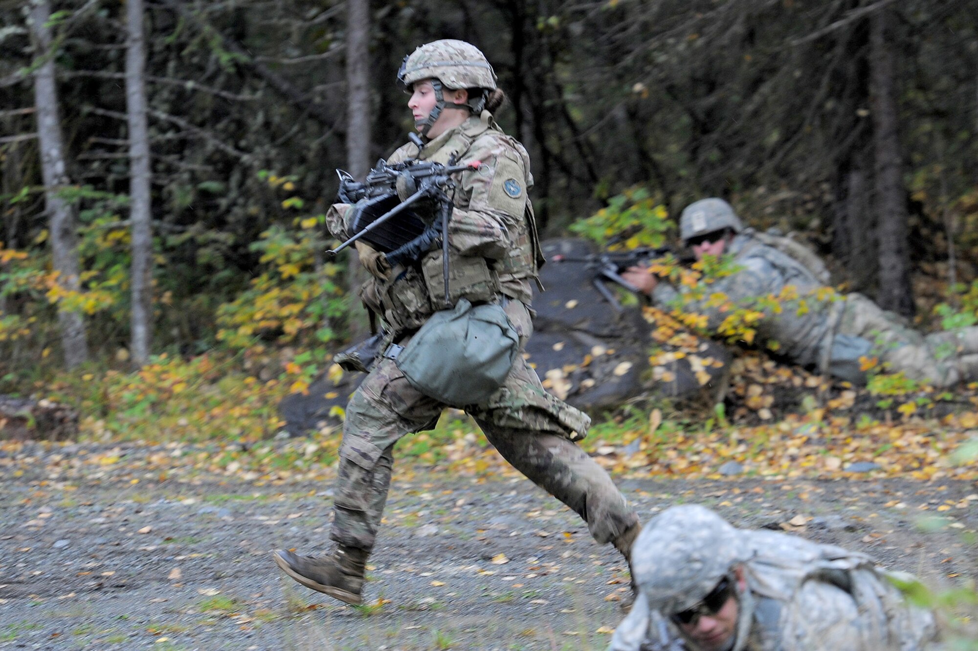 Spc. Shelbe Butner, assigned to the 109th Transportation Company "Muleskinners", 17th Combat Sustainment Support Battalion, U.S. Army Alaska, crosses a danger area as fellow Soldiers cover her movement while capturing an objective on Joint Base Elmendorf-Richardson, Alaska, Sept. 21, 2017.  The Soldiers performed this training as part of a larger exercise in multiple locations to build, and maintain proficiency in essential soldiering skills.