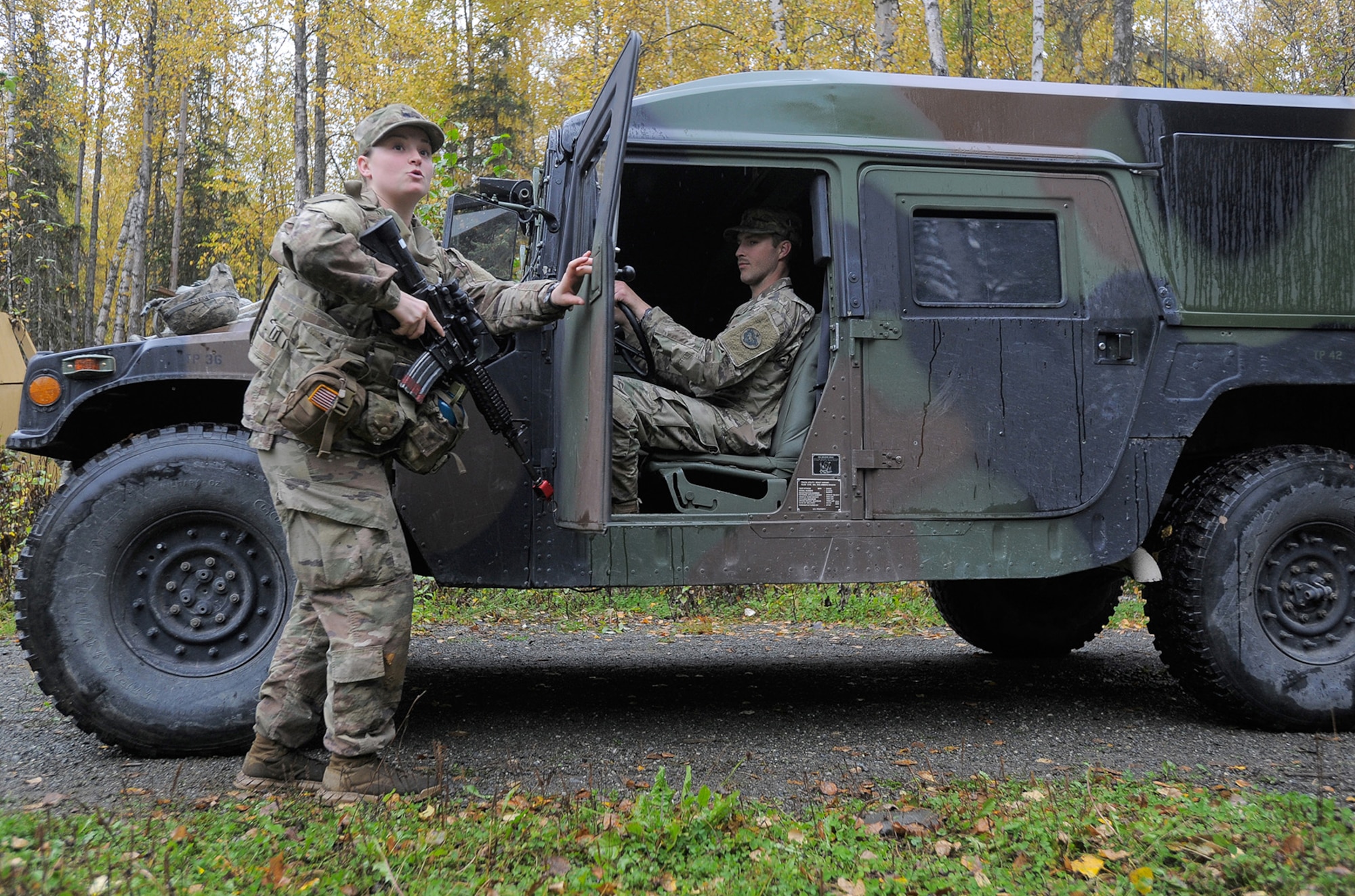 Spc. Shelbe Butner, assigned to the 109th Transportation Company "Muleskinners", 17th Combat Sustainment Support Battalion, U.S. Army Alaska, demonstrates traffic control point procedures for fellow Soldiers on Joint Base Elmendorf-Richardson, Alaska, Sept. 21, 2017.  The Soldiers performed this training as part of a larger exercise in multiple locations to build, and maintain proficiency in essential soldiering skills.
