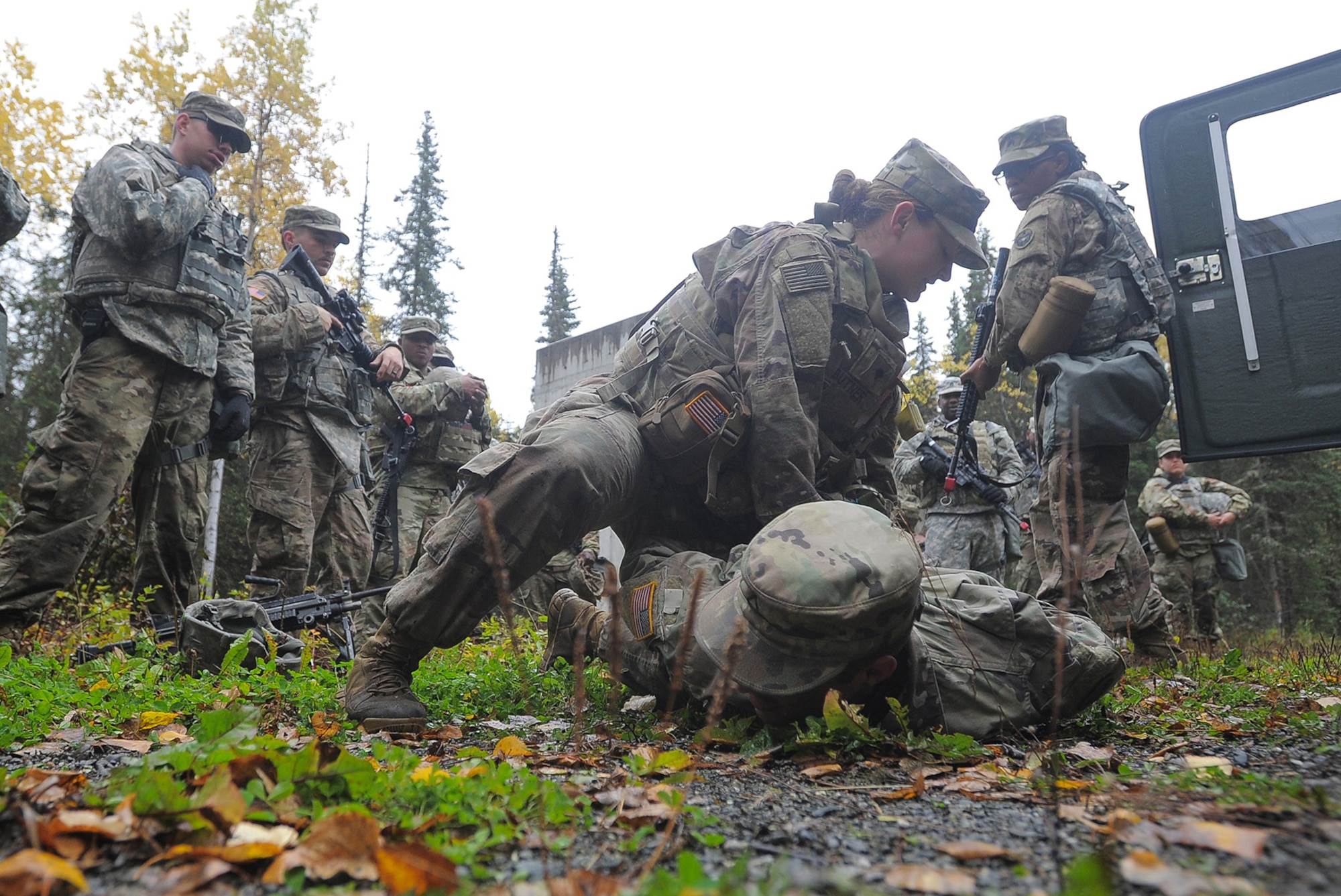Spc. Shelbe Butner, assigned to the 109th Transportation Company "Muleskinners", 17th Combat Sustainment Support Battalion, U.S. Army Alaska, demostrates apprehending a subject at traffic control point training on Joint Base Elmendorf-Richardson, Alaska, Sept. 21, 2017.  The Soldiers performed this training as part of a larger exercise in multiple locations to build, and maintain proficiency in essential soldiering skills.