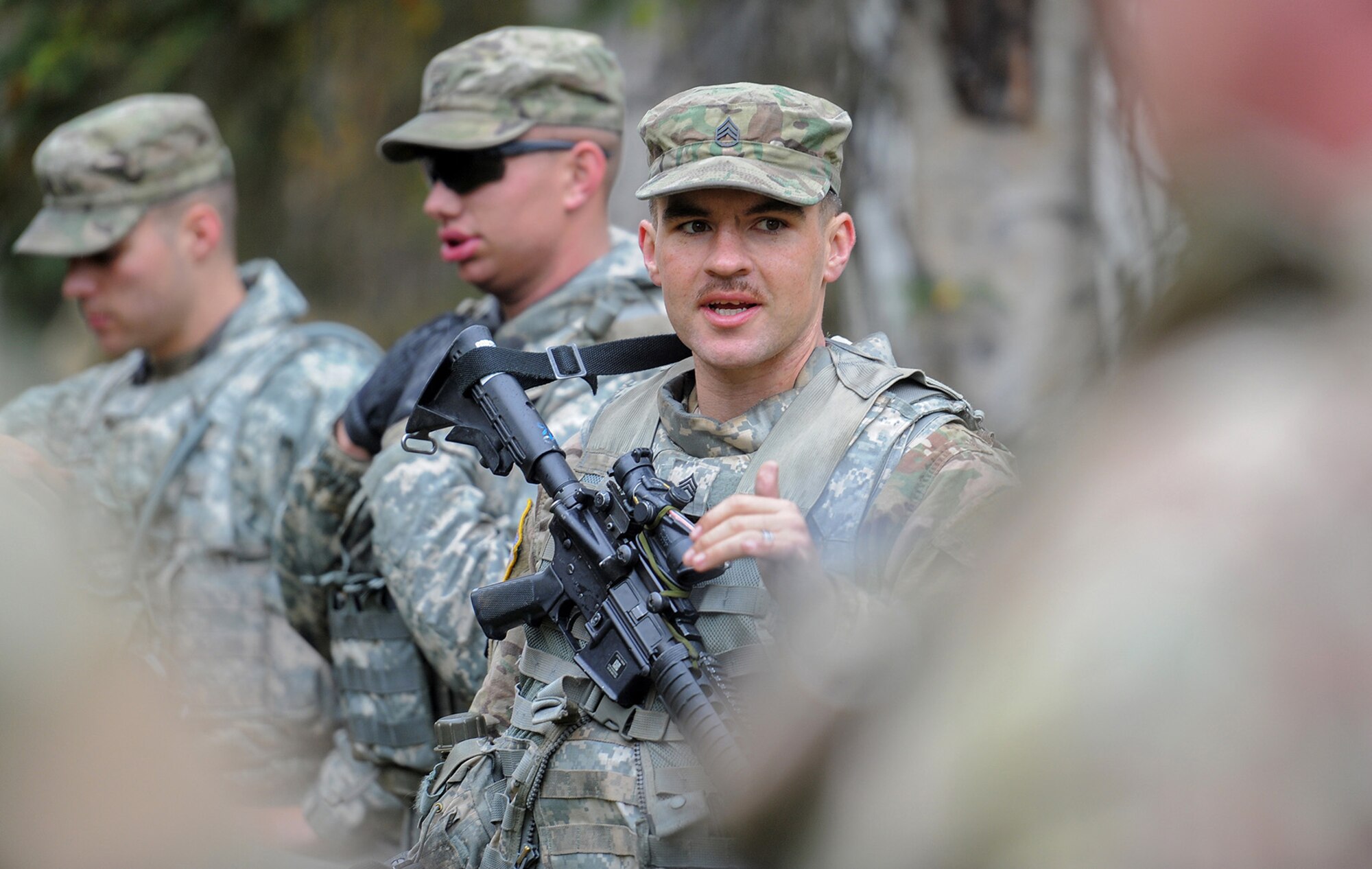 Army Staff Sgt. David Riley, assigned to the 109th Transportation Company "Muleskinners", 17th Combat Sustainment Support Battalion, U.S. Army Alaska, instructs Soldiers during traffic control point training on Joint Base Elmendorf-Richardson, Alaska, Sept. 21, 2017.  The Soldiers performed this training as part of a larger exercise in multiple locations to build, and maintain proficiency in essential soldiering skills.