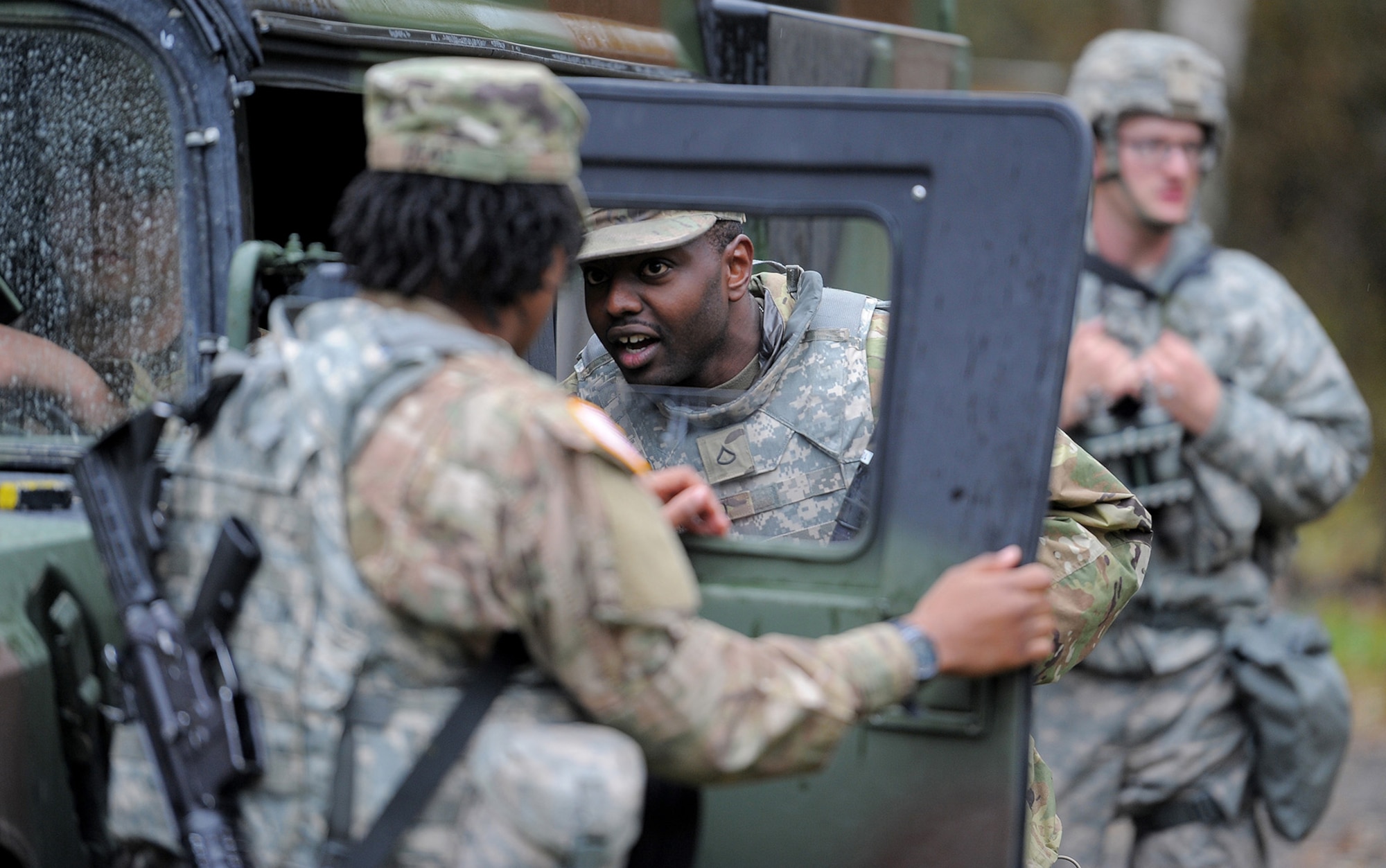 Army Pfc. Randy Zakayo, assigned to the 109th Transportation Company "Muleskinners", 17th Combat Sustainment Support Battalion, U.S. Army Alaska, receives instruction from Army Sgt. Shatavia Deas, left, during traffic control point training on Joint Base Elmendorf-Richardson, Alaska, Sept. 21, 2017.  The Soldiers performed this training as part of a larger exercise in multiple locations to build, and maintain proficiency in essential soldiering skills.