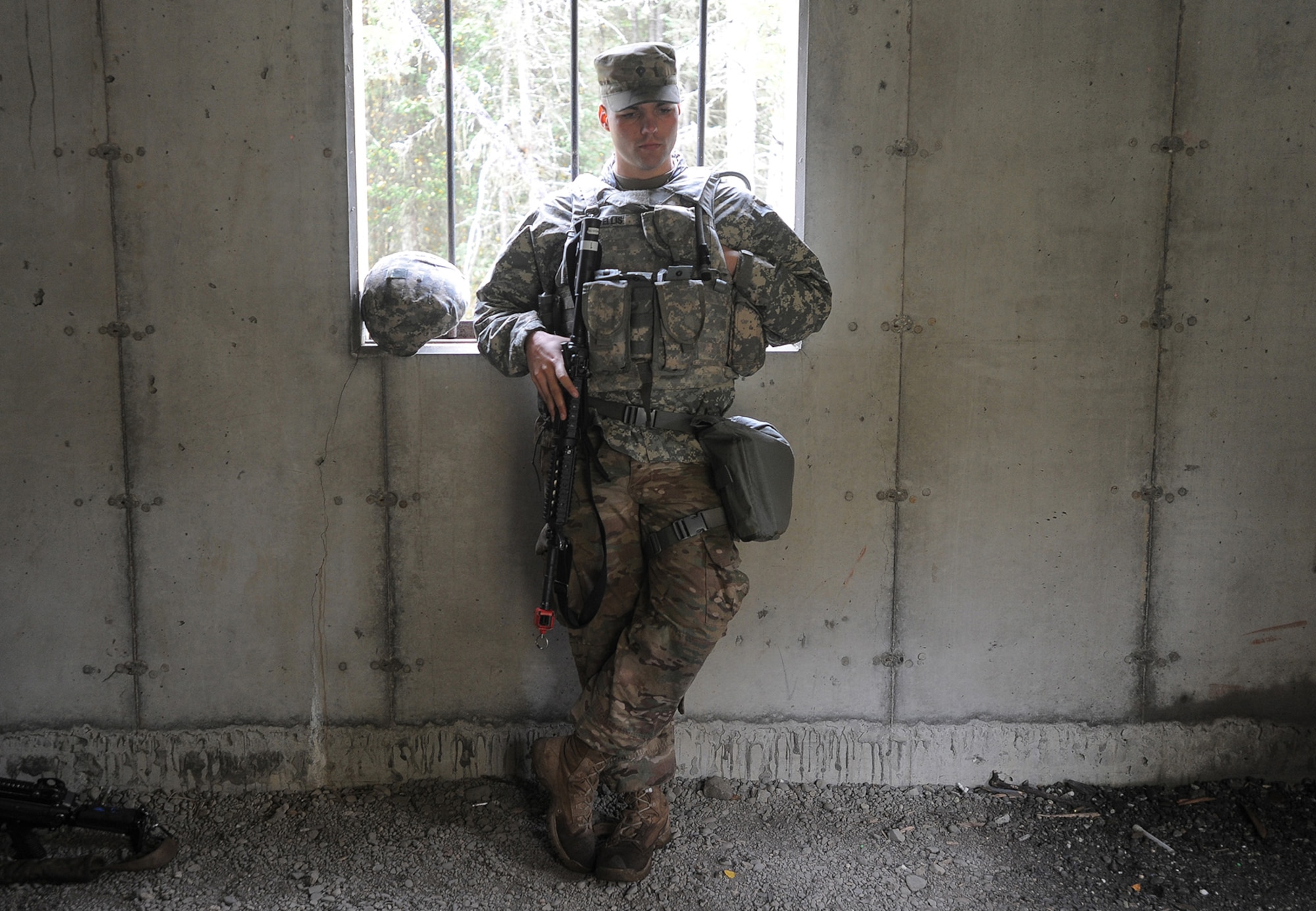 Spc. Austin Ellis, assigned to the 109th Transportation Company "Muleskinners", 17th Combat Sustainment Support Battalion, U.S. Army Alaska, takes a break during traffic control point training on Joint Base Elmendorf-Richardson, Alaska, Sept. 21, 2017.  The Soldiers performed this training as part of a larger exercise in multiple locations to build, and maintain proficiency in essential soldiering skills.
