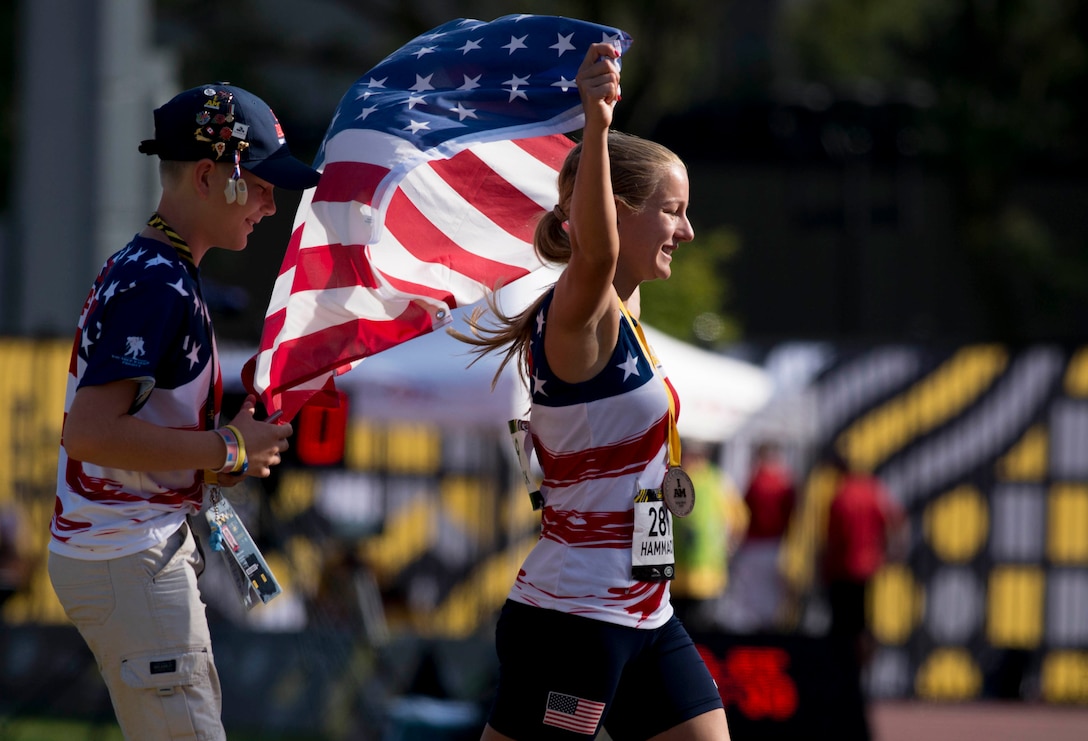 Marine Corps veteran Cpl. Jessica-Rose Hammack celebrates after receiving a bronze medal during Athletics at York Lions Stadium during the 2017 Invictus Games in Toronto on September 25, 2017. The Invictus Games, established by Prince Harry in 2014, brings together wounded and injured veterans from 17 nations for 12 adaptive sporting events, including track and field, wheelchair basketball, wheelchair rugby, swimming, sitting volleyball, and new to the 2017 games, golf.    (DoD photo by Roger L. Wollenberg)
