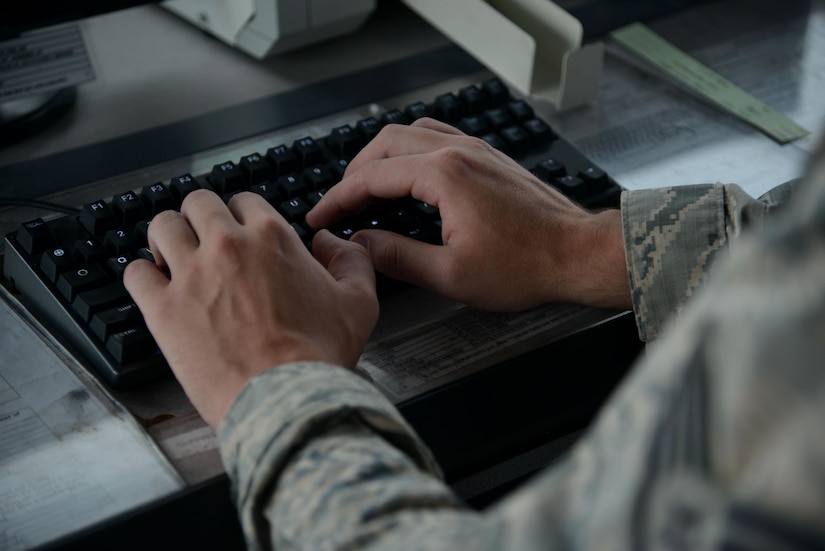 U.S. Air Force Staff Sgt. Joshua Shaffer, 1st Operations Support Squadron tower watch supervisor works at his station at Joint Base Langley-Eustis, Va., Sept. 26, 2017.