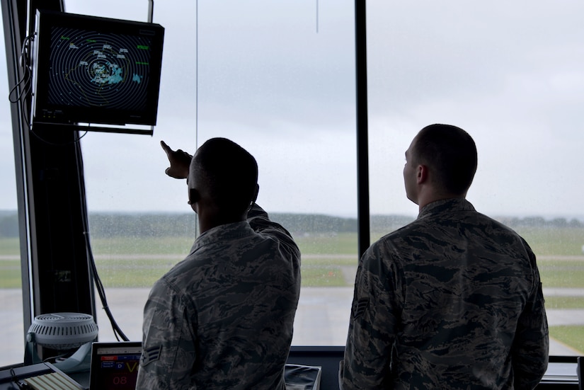 (From left) U.S. Air Force Senior Airman Richard Smith, 1st Operation Support Squadron air traffic controller, shows Staff Sgt. Joshua Shaffer, 1st OSS tower watch supervisor, a radar screen at Joint Base Langley-Eustis, Va., Sept. 26, 2017.