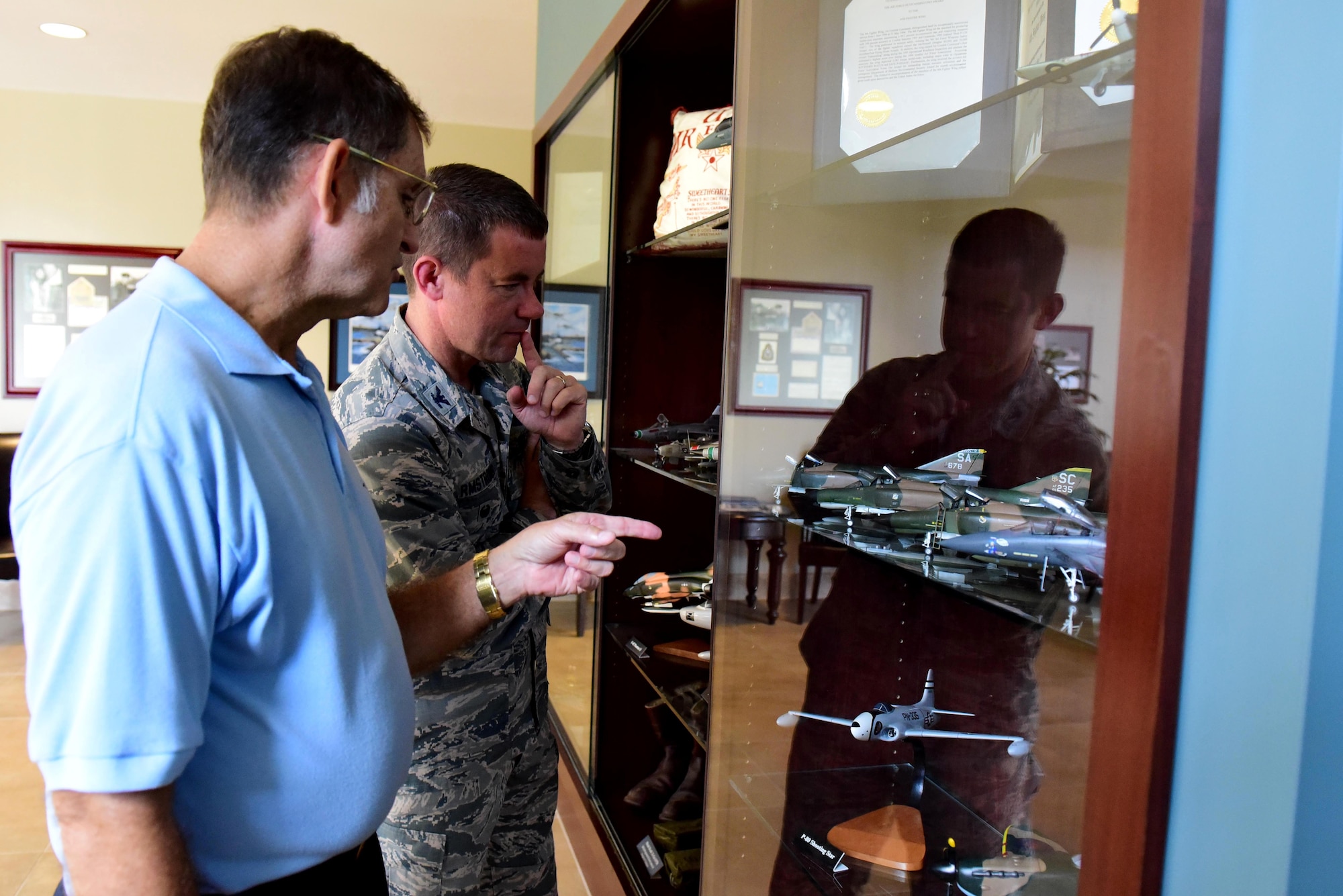 Retired Tech. Sgt. Bob Dedmon (left), discusses model aircraft with Col. Brian Armstrong, 4th Fighter Wing vice commander, Sept. 27, 2017, at Seymour Johnson Air Force Base, North Carolina.