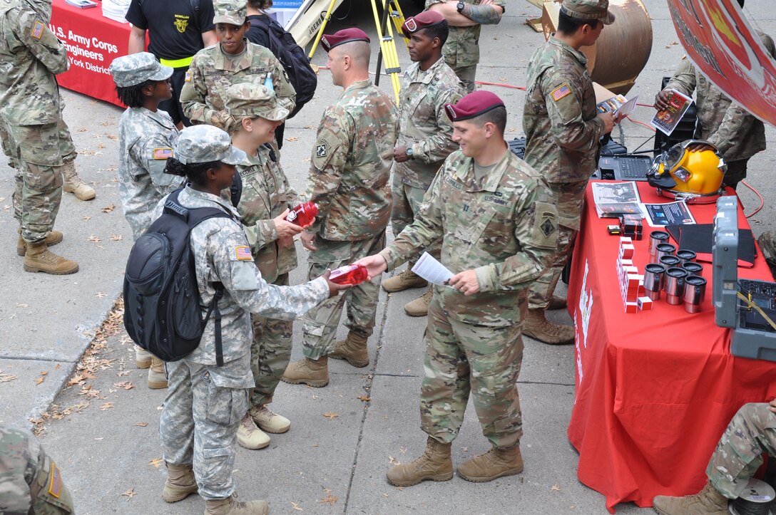 Solider from the 20th Engineer Brigade hand out memorabilia to cadets at Branch Week for the U.S. Military Academy at West Point.