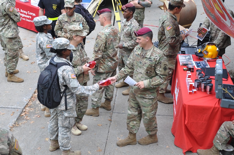 Solider from the 20th Engineer Brigade hand out memorabilia to cadets at Branch Week for the U.S. Military Academy at West Point.