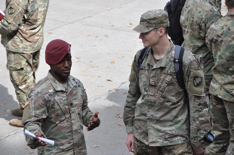 Soldier from the 20th Engineer Brigade advises cadet about the opportunities in the Army Corps of Engineers Regiment Branch.
