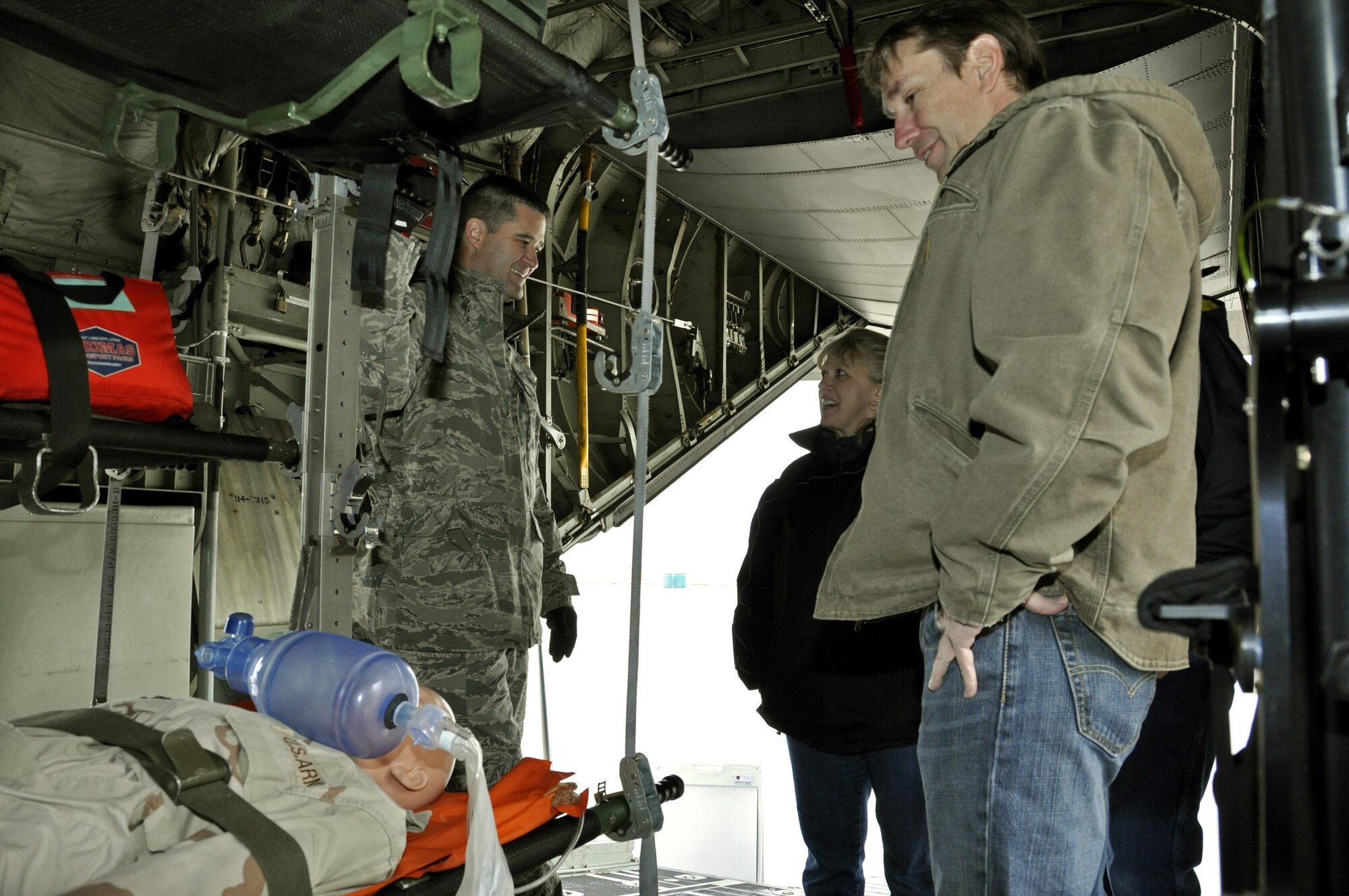 Capt. Damon Petersen, left, a 34th Aeromedical Evacuation Squadron medical evacuations operations officer, speaks with attendees of the Pikes Peak Regional Airshow Sept. 24, 2017, at the Colorado Springs Airport, Colo.