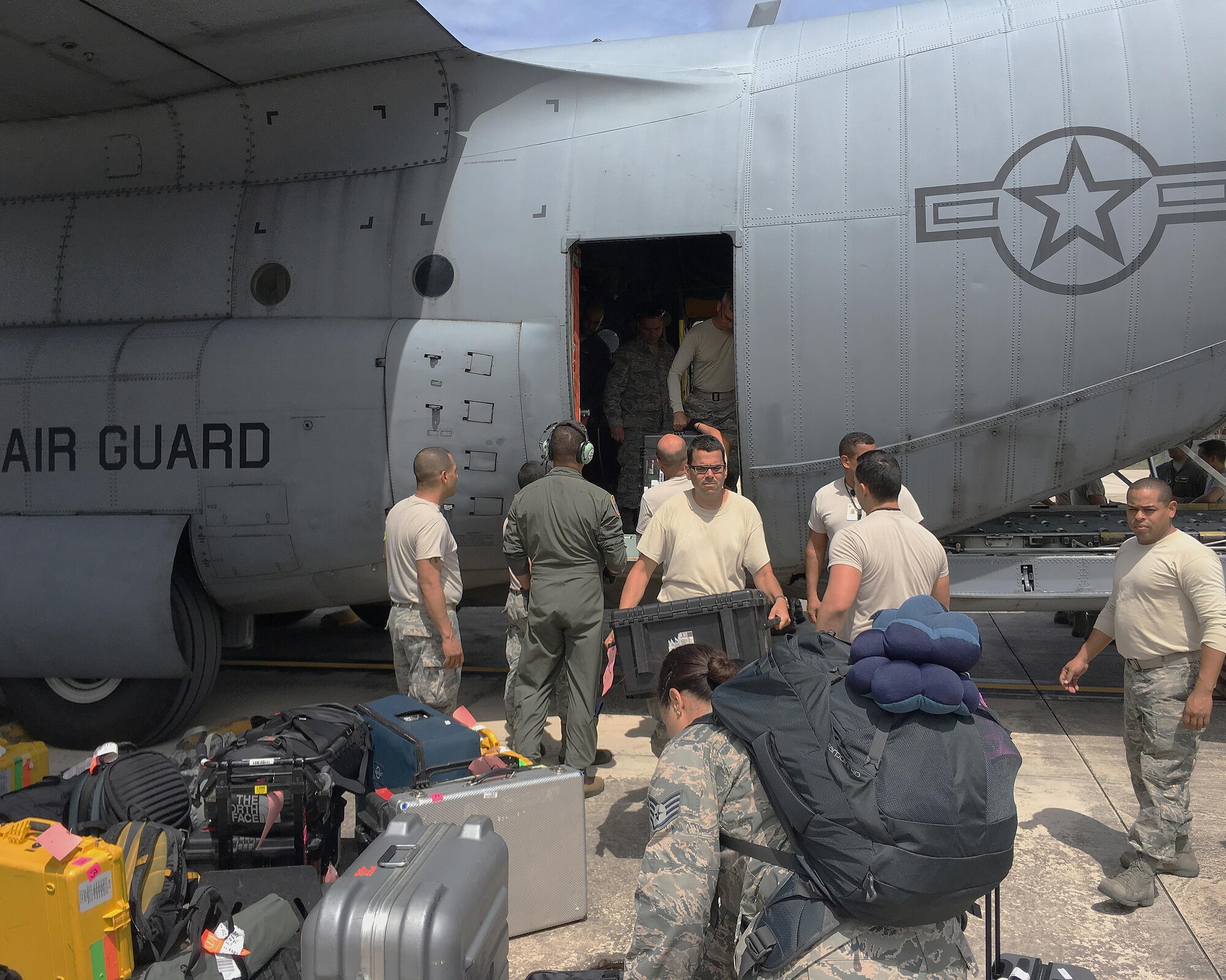 Airmen from the 156th Airlift Wing, Puerto Rico Air National Guard, unload supplies from a C-130 Hercules at Muniz Air National Guard Base in Puerto Rico in response to Hurricane Maria, Sept. 23, 2017. The Puerto Rico Air National Guard is working with numerous local and federal agencies in response to Hurricane Maria. (U.S. Air National Guard photo by Tech. Sgt. Dan Heaton)