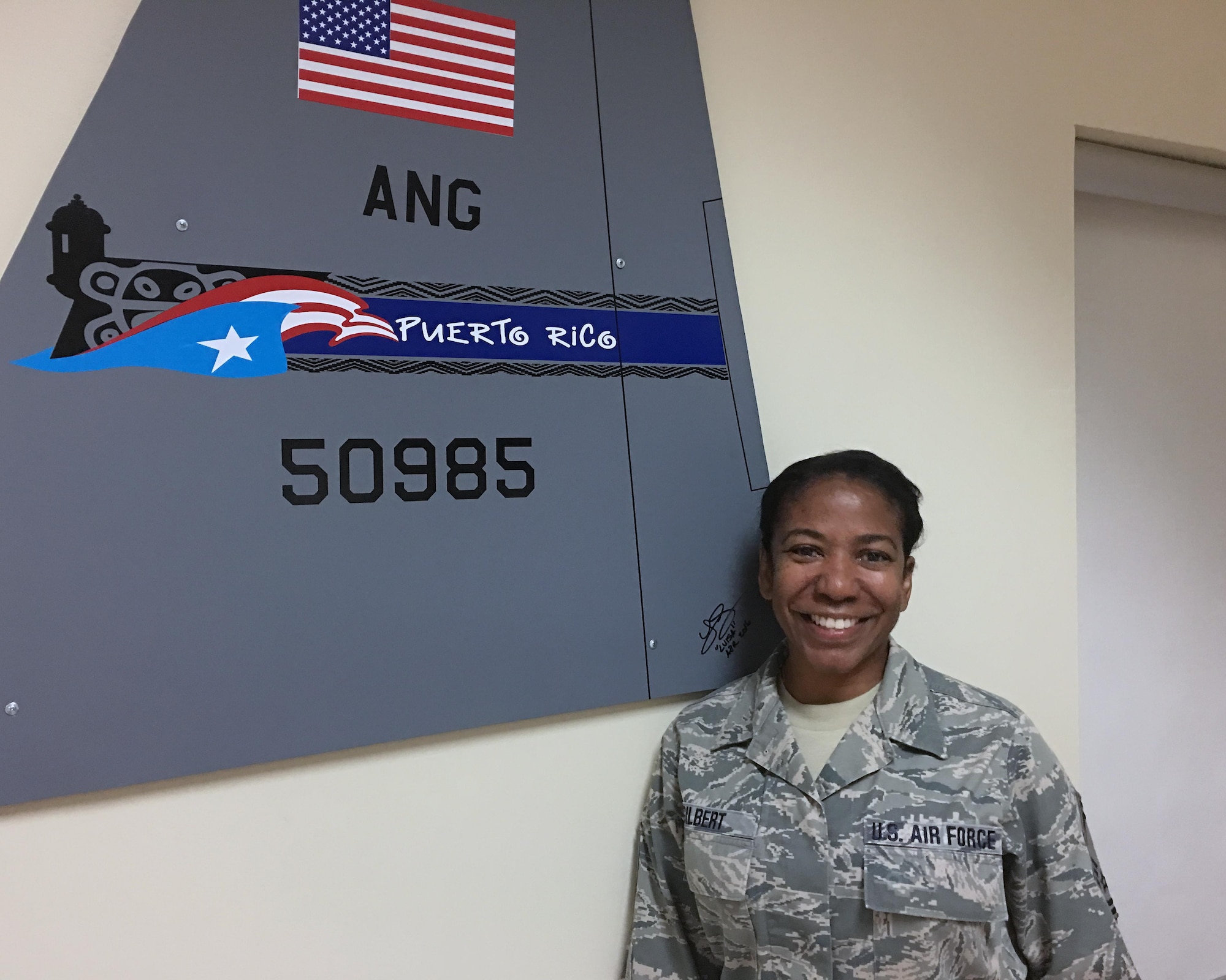 Senior Master Sgt. Mildred Gilbert a member of the command post, takes a break in the operations building at Muniz Air National Guard Base, Puerto Rico to share her firsthand account of surviving a natural disaster. She is one of hundreds of local Air National Guard personnel who showed up at the base, seeking to service his community in the aftermath of Hurricane Maria, which hit Puerto Rico on Sept. 20, 2017. (U.S. Air National Guard photo by Tech. Sgt. Dan Heaton)