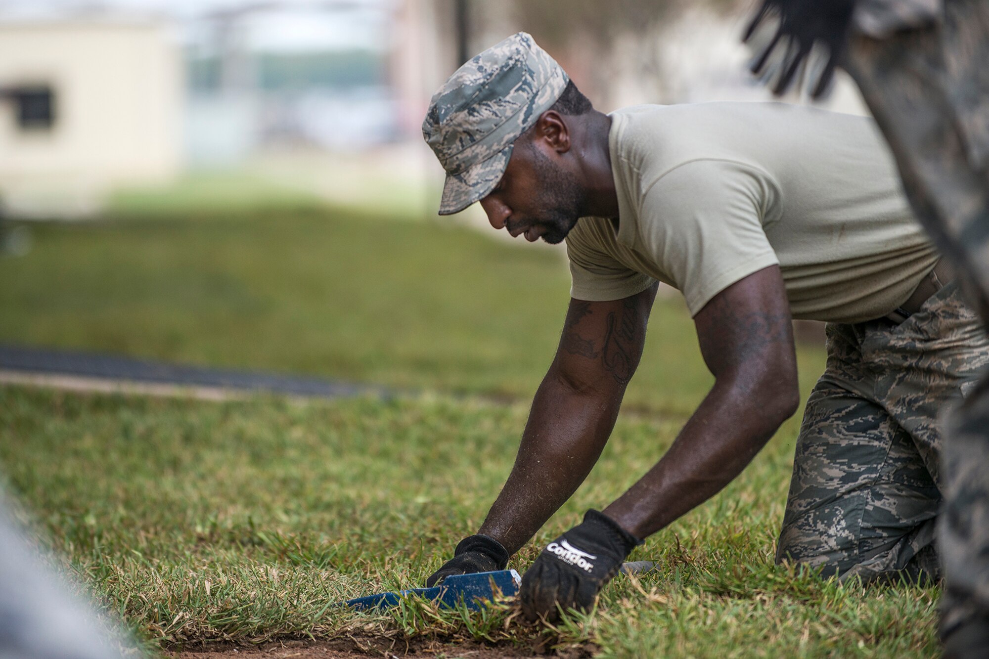 An Airman assigned to the 307th Civil Engineer Squadron lays sod on Sept. 27, 2017, Barksdale Air Force Base, La.
