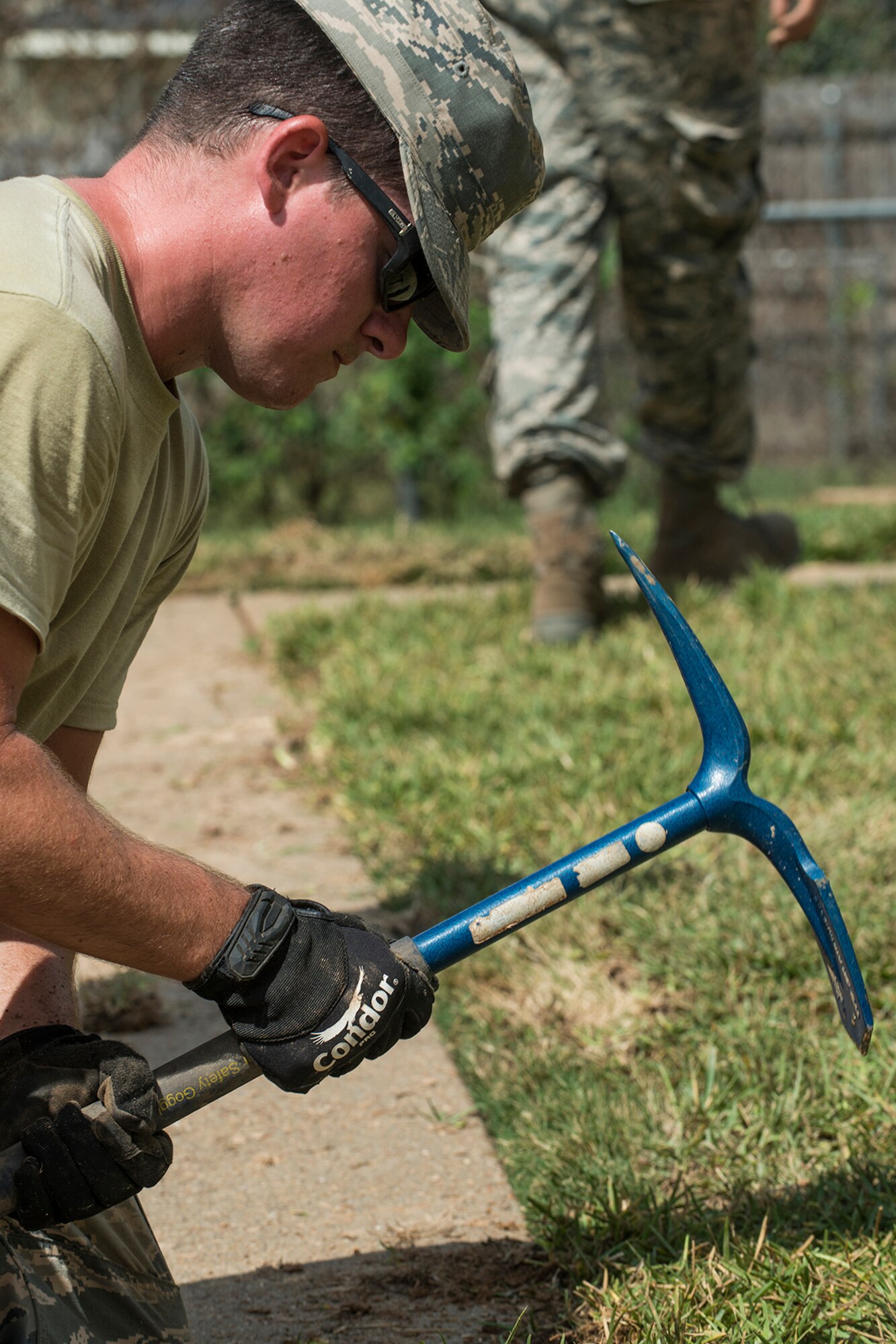 An Airman assigned to the 307th Civil Engineer Squadron trims freshly laid sod at the edge of a sidewalk, Sept. 27, 2017, Barksdale Air Force Base, La.