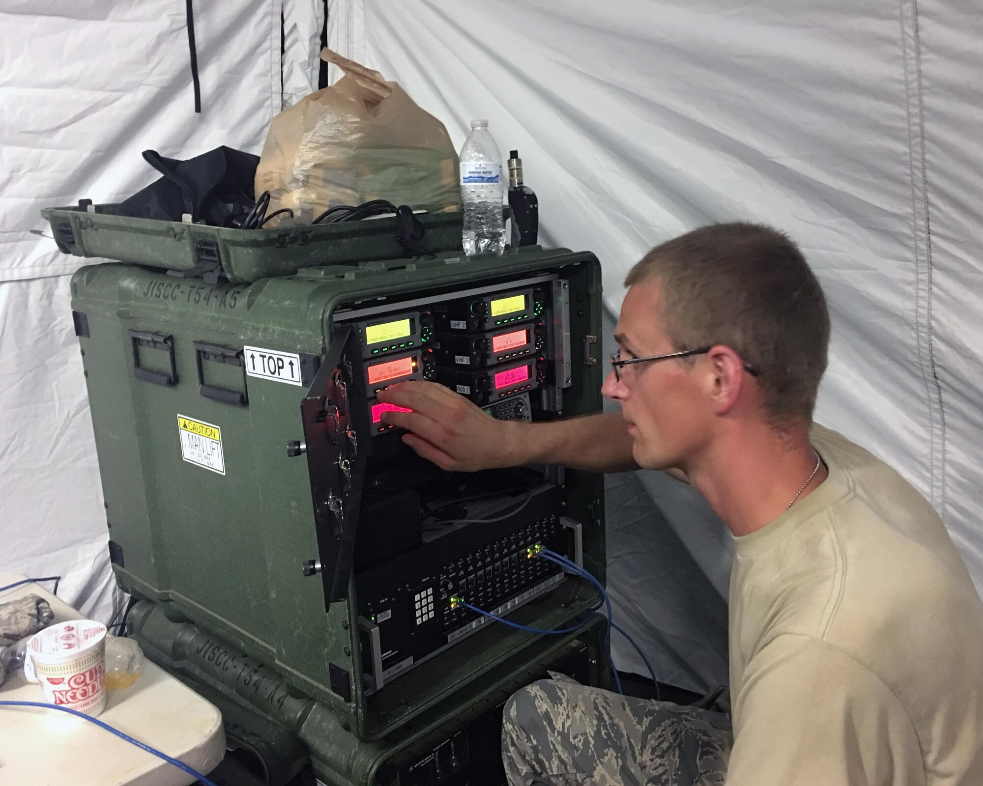 Staff Sgt. Michael Raatz of the Illinois Air National Guard’s 126th Communications Flight fine tunes a radio frequency control unit in a Joint Incident Site Communications Capability site at Muniz Air National Guard Base, Puerto Rico. The Air National Guard is working with many federal, territory and local agencies in response to Hurricane Maria. (U.S. Air National Guard photo by Tech. Sgt. Dan Heaton)